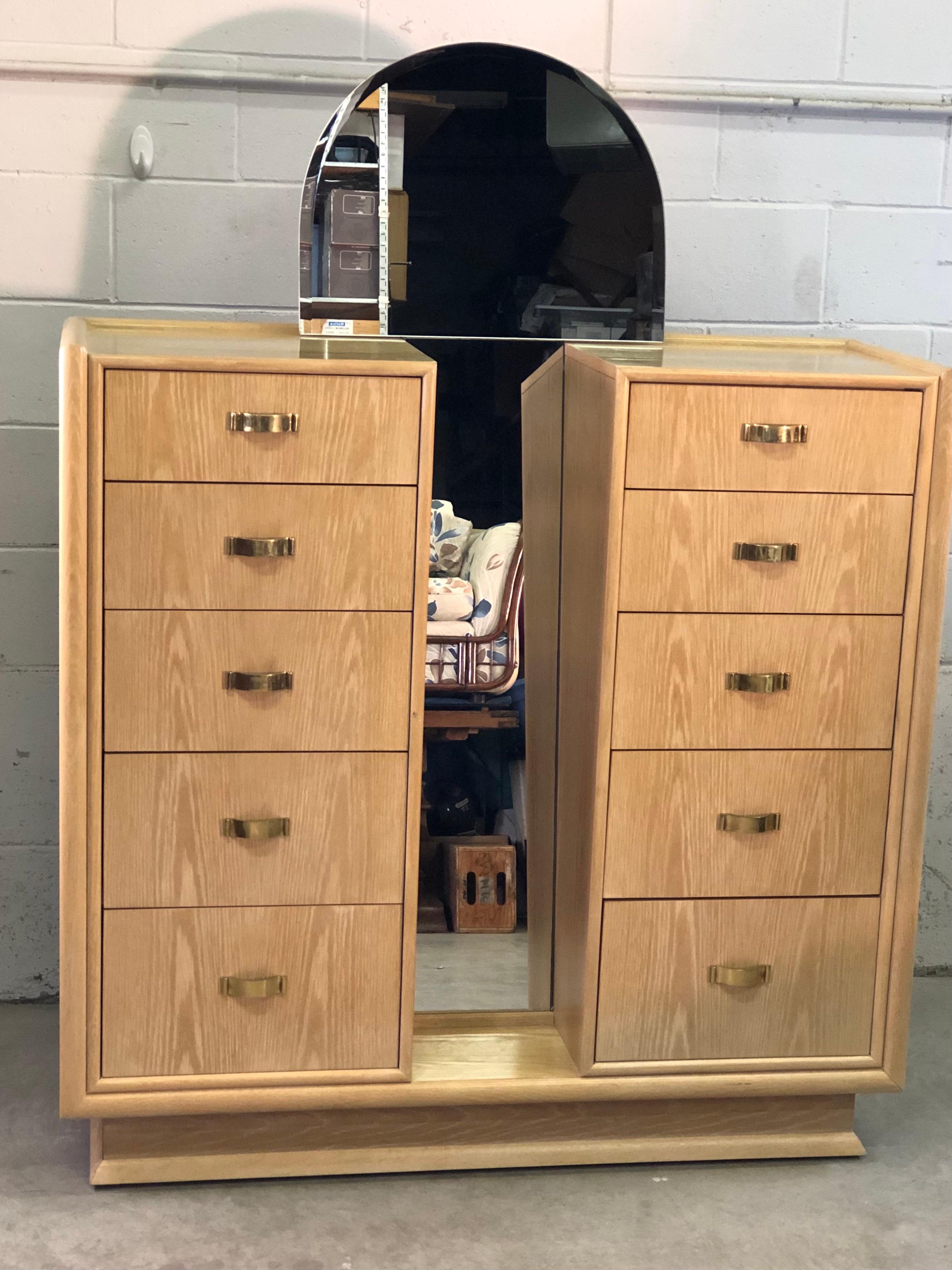 Vintage 1980s white washed oak dresser with mirror by Century Furniture. The dresser has 10 drawers for storage. The drawers measure from 3.5 - 9” high. The pulls are solid brass. The dresser is 48”H without the mirror. Marked inside the drawer.