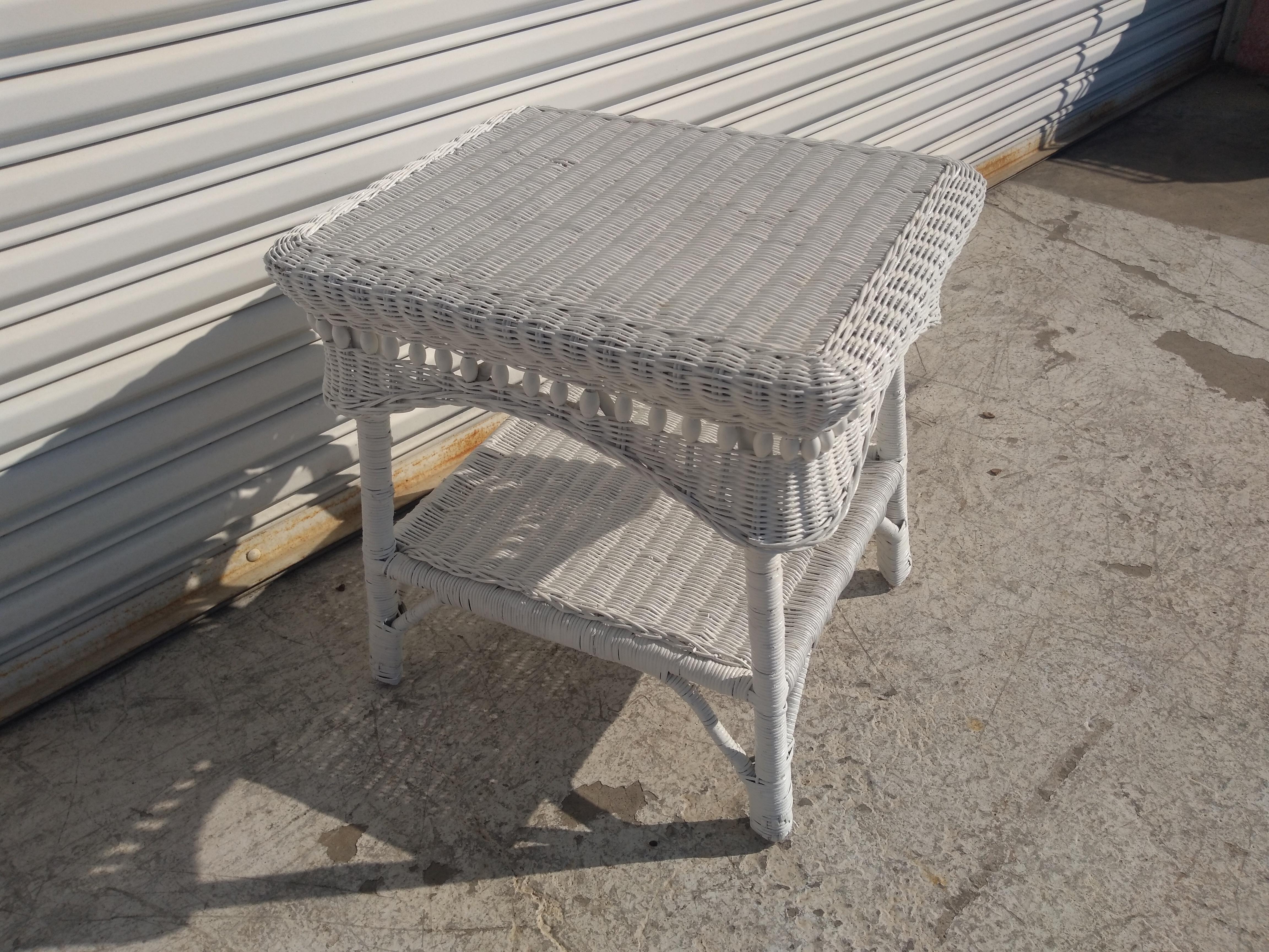 This is a nicely woven rattan side table. If Boho Chic is your thing, this is your table. It's square with rounded corners. Has a shelf below for storage. It's a nice addition to the boho chic decor.