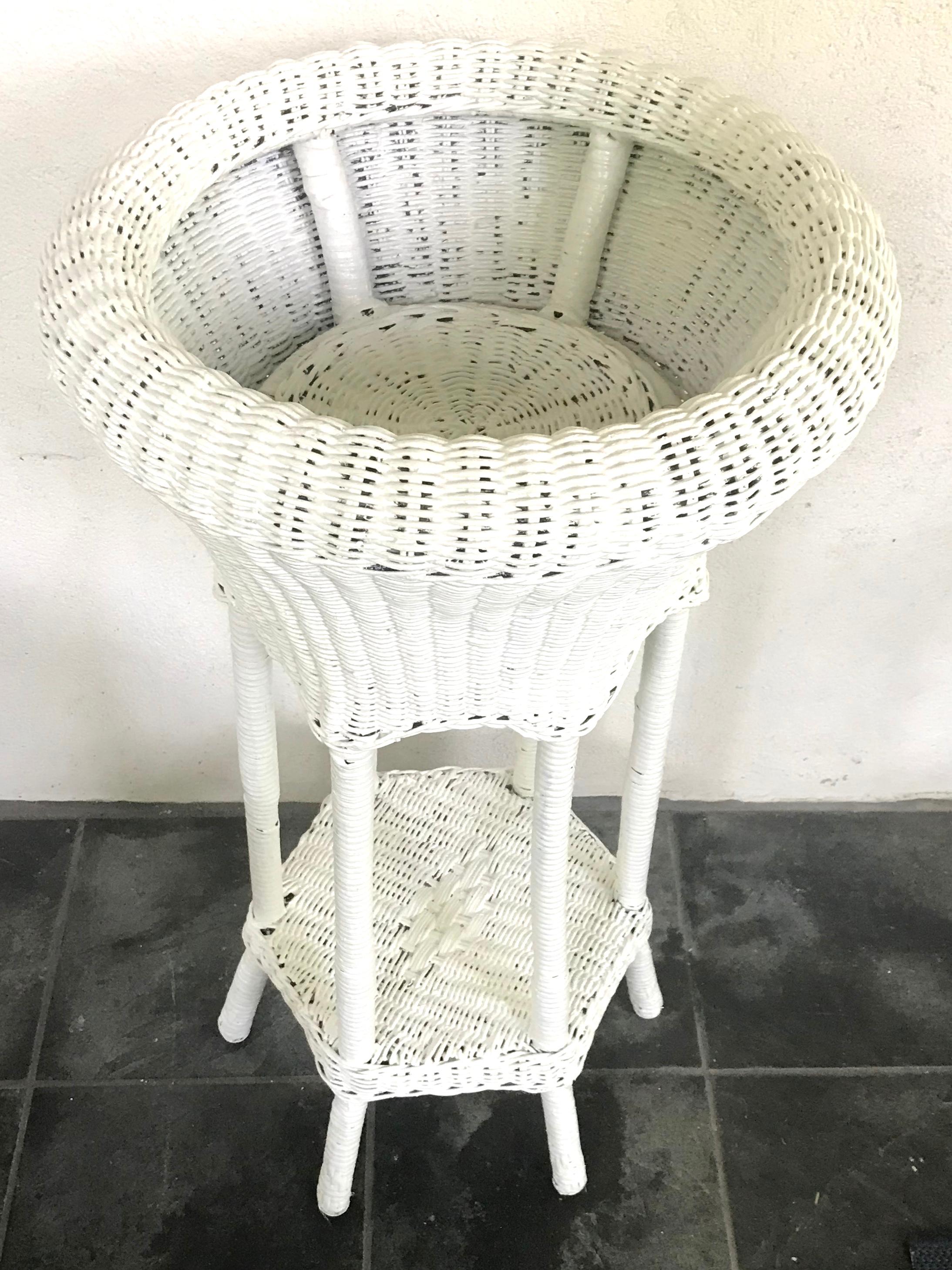 white wicker plant stands