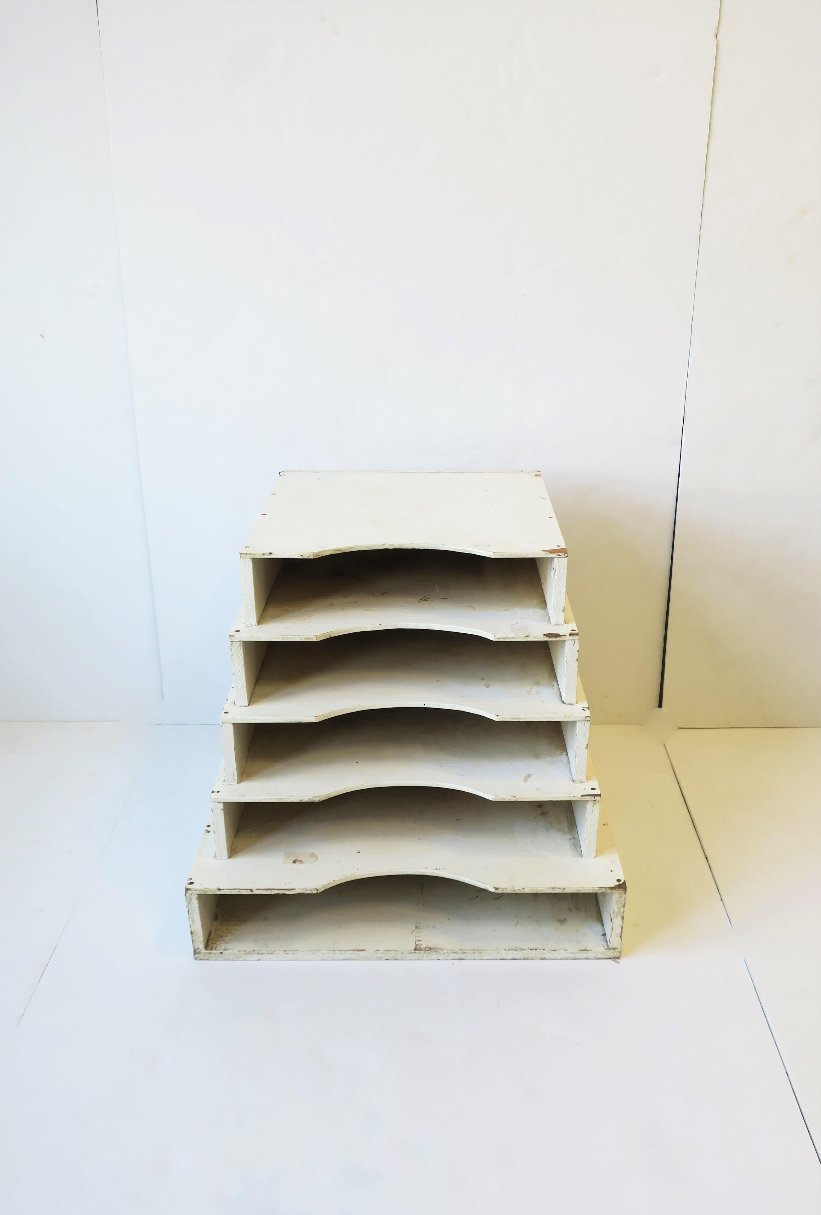 A white wood sandpaper box holder turned industrial table with shelves, circa mid-20th century, 1950s, 1960s, USA. Piece is tapered, hand-painted white wood, originally designed to hold sheets of sandpaper in a carpenter's workshop. Today, piece can