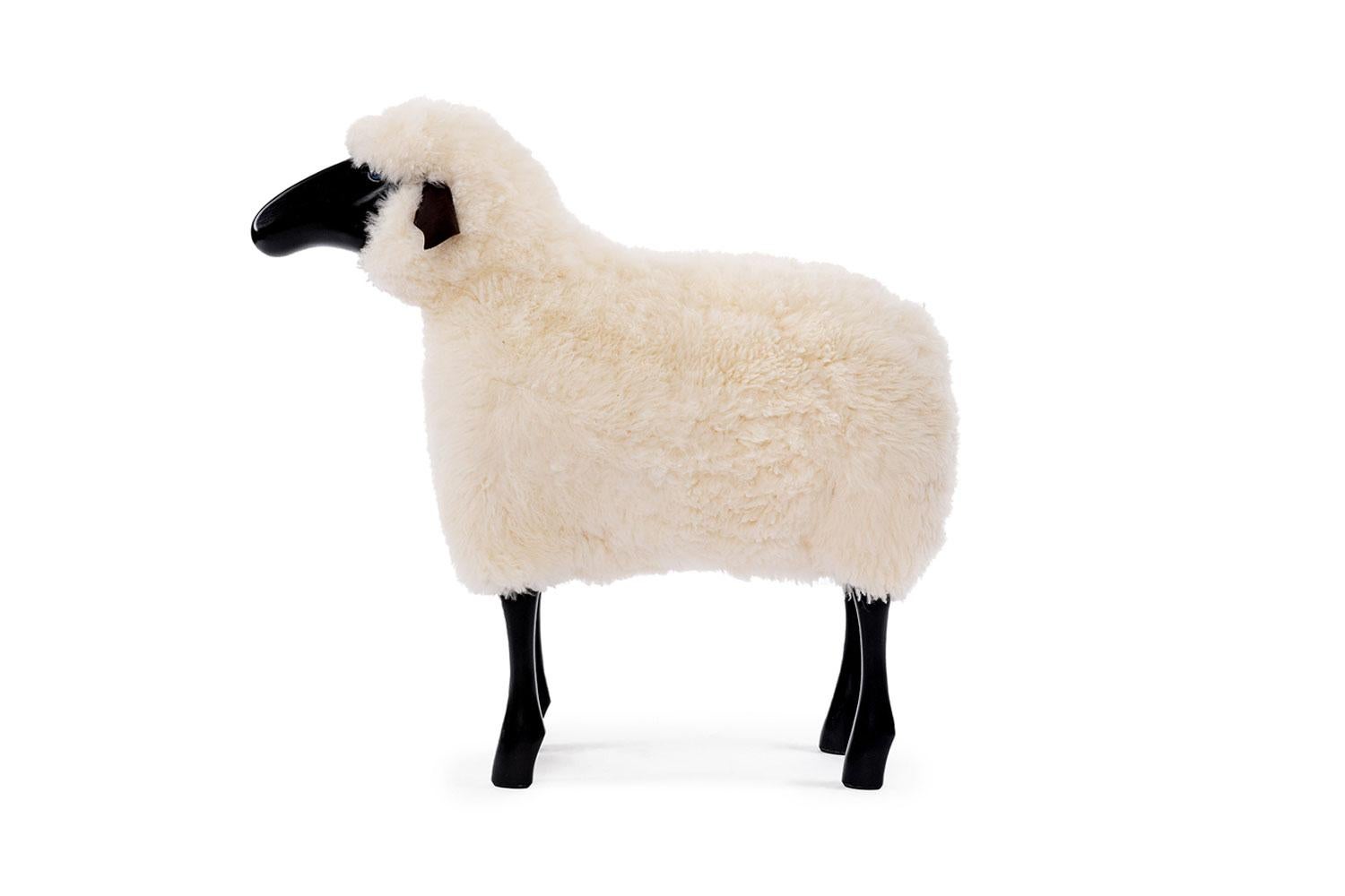 White Wool Life-Sized Sheep

This life-sized sheep with real sheepskin on black stained beechwood face and legs and natural dark leather ears is suitable as original seating, ottoman or for decoration. Use as a stool for example, around a dining