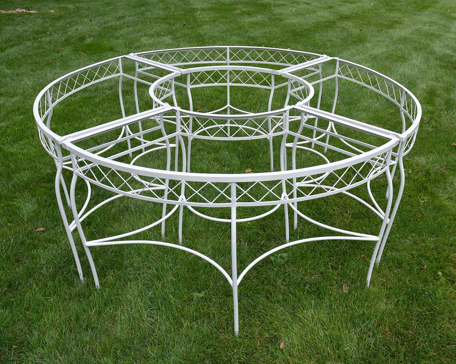 A set of four quarter-circular wrought-iron tables, with glass inserts, grouped in a circle, American, ca. 1940. Some photos taken without glass inserts. A very flexible and useful table that works in so many situations and one that is from a very