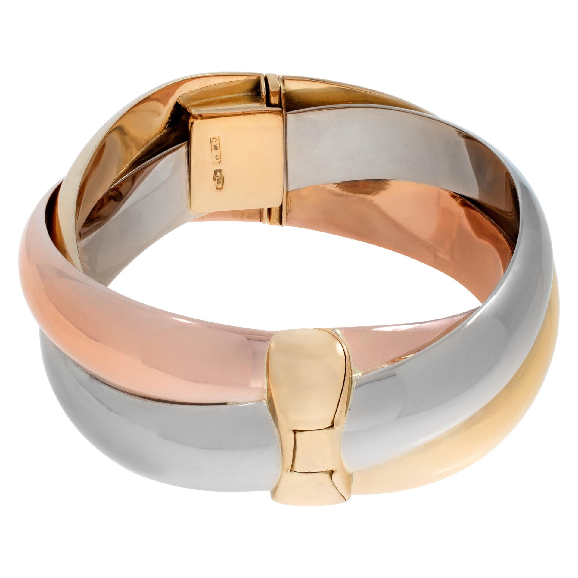 Wide tri-color bangle bracelet in 18k white, yellow and rose gold intertwined together. 0.75 inch width.

