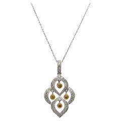 White & Yellow Floating Diamond 18 Karat White Gold Modern Pendant Necklace