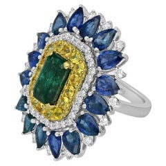 Bague en or blanc et jaune 18 carats avec diamants, émeraudes et saphirs bleus et jaunes