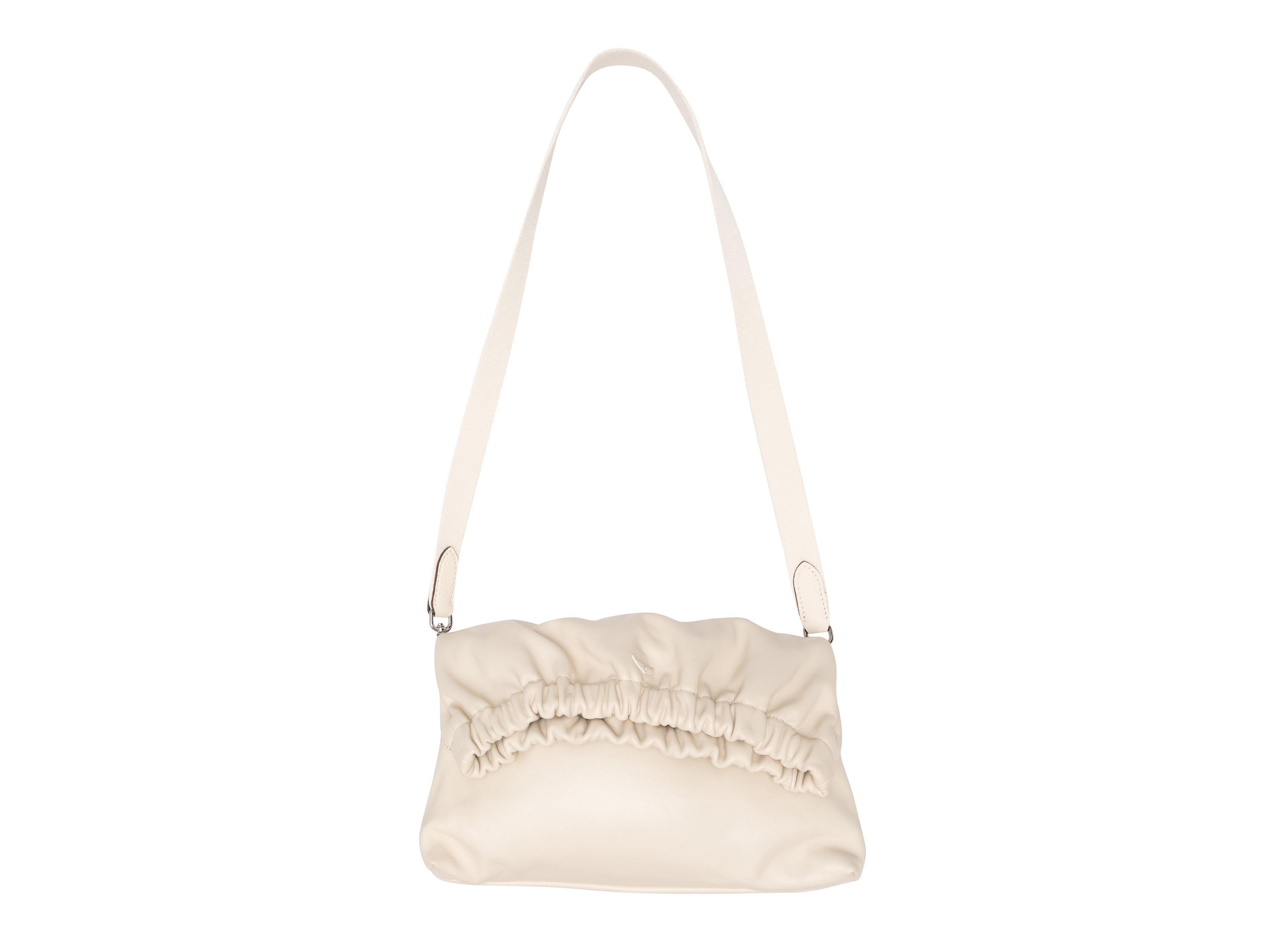 White Zadig & Voltaire Rockyssime Shoulder Bag. The Rockyssime bag features a leather body, silver-tone hardware, multiple strap options, and a foldover top. 12