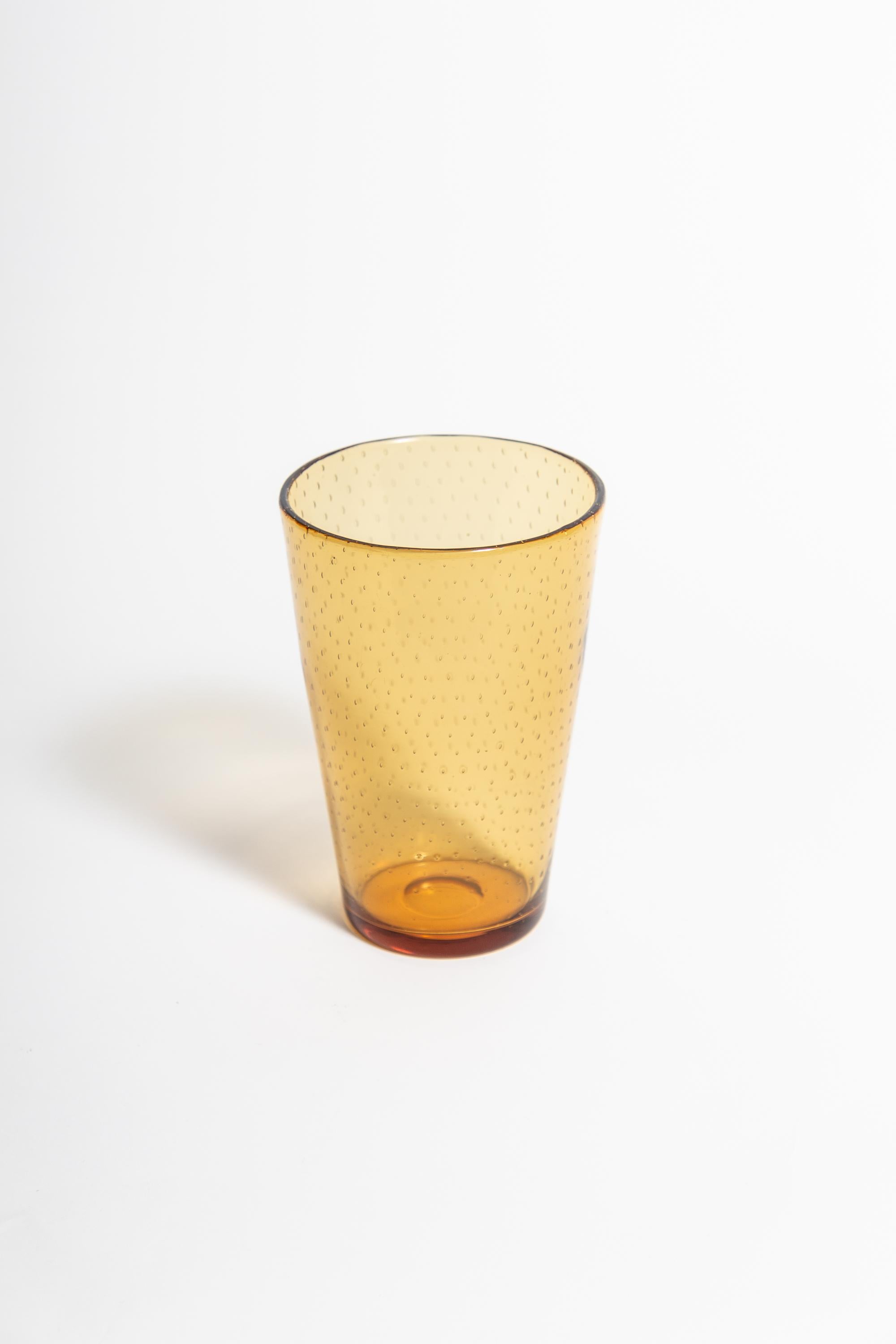 Whitefriars amber bubble vase by William Wilson, 1940s.

A 1940s William Wilson of Whitefriars controlled or encased bubble vase in amber glass. Polished pontil to the base. Produced during William Wilsons tenure as Chief Designer at the