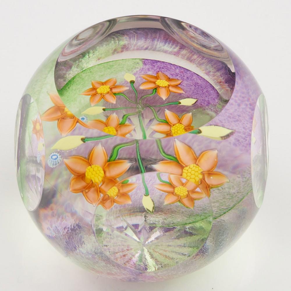 Heading : A Whitefriars Caithness Allan Scott Golden Awakening Paperweight 1998
Date : 1998
Origin : Scotland
Features : Four orange lampwork flowers and buds on a quarter coloured ground facet cut to top and sides
Marks : Whitefriars Caithness