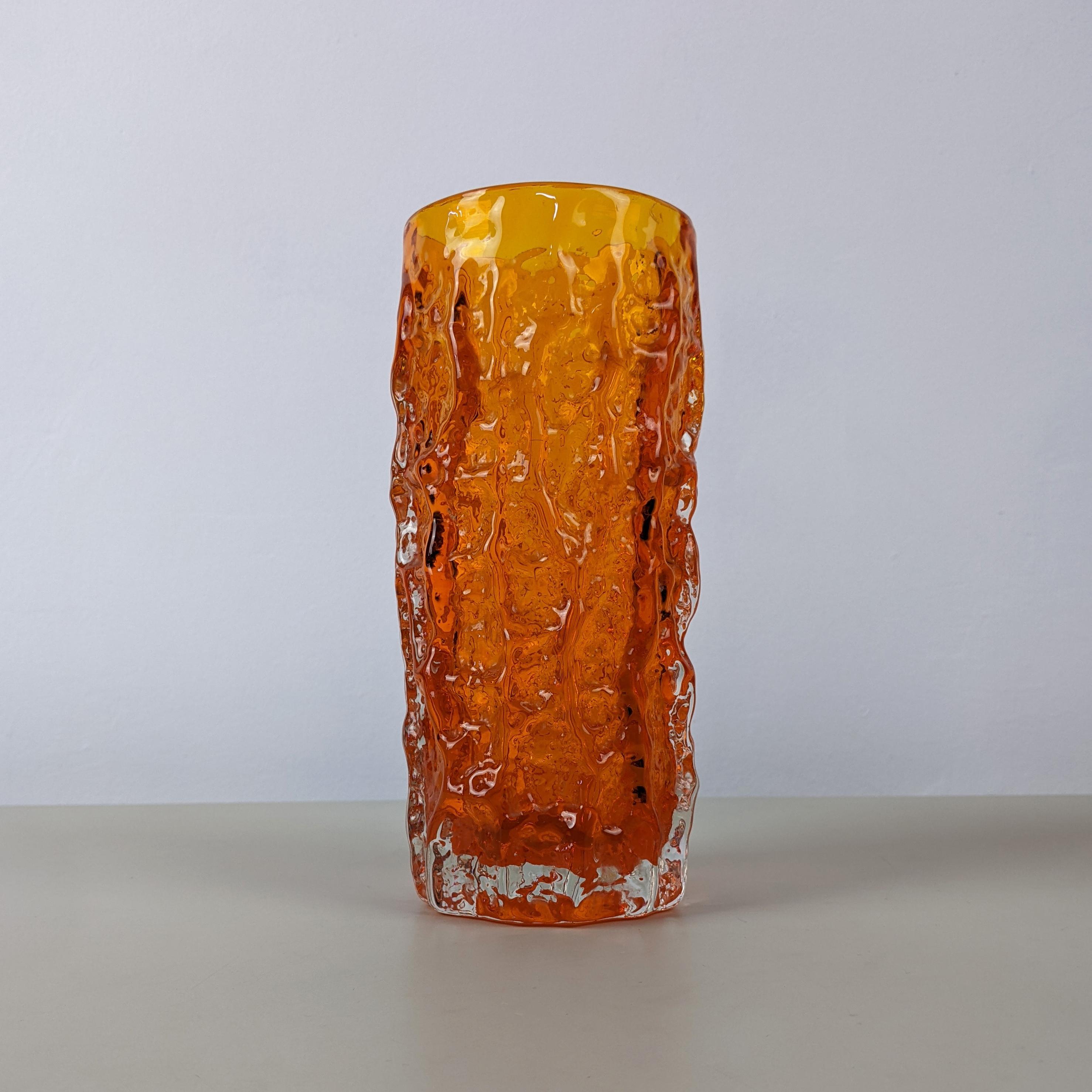 Geoffrey Baxter for Whitefriars, c. 1960s
Medium ‘Bark’ vase, from the “Textured’ range, model number 9690
Orange tinted glass
Excellent condition without damage



Dimensions (approx.): Height 19cm, diameter 8.5cm
Weight: 1000g.