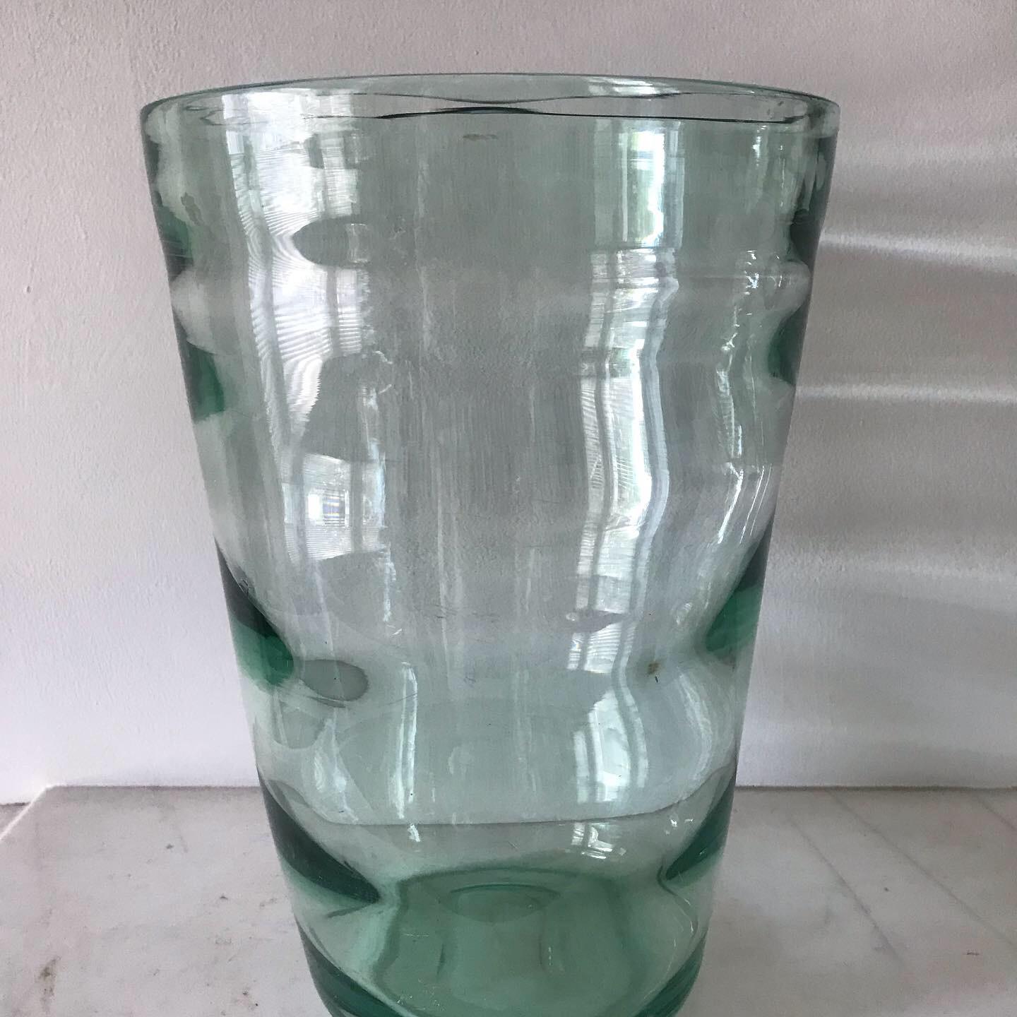 A lovely example of a sea green optical whitefriars vase. Probably designed by either James Hogan or William Wilson. These type of vases stopped being produced by 1957. Heavy handblown with a clever optical effect.