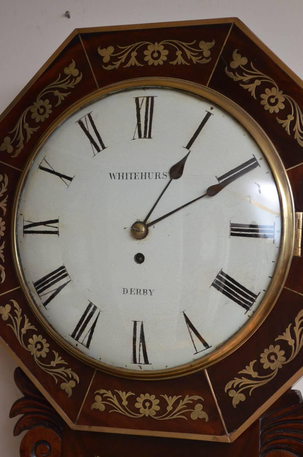 Sn3122, fine quality, Regency, mahogany wall clock by Whitehurst of Derby, having original painted dial with Roman numerals, original hands and convex glass with brass bezel, in octagonal, mahogany, brass inlaid case with carved 'ears' below, circa
