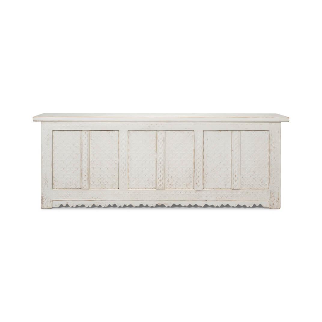 Carved from reclaimed pine and finished in a distressed and antiqued whitewash, this piece exudes rustic charm. Six cabinet doors open to reveal a painted interior with removable shelves, offering both functionality and style.

Dimensions: 98