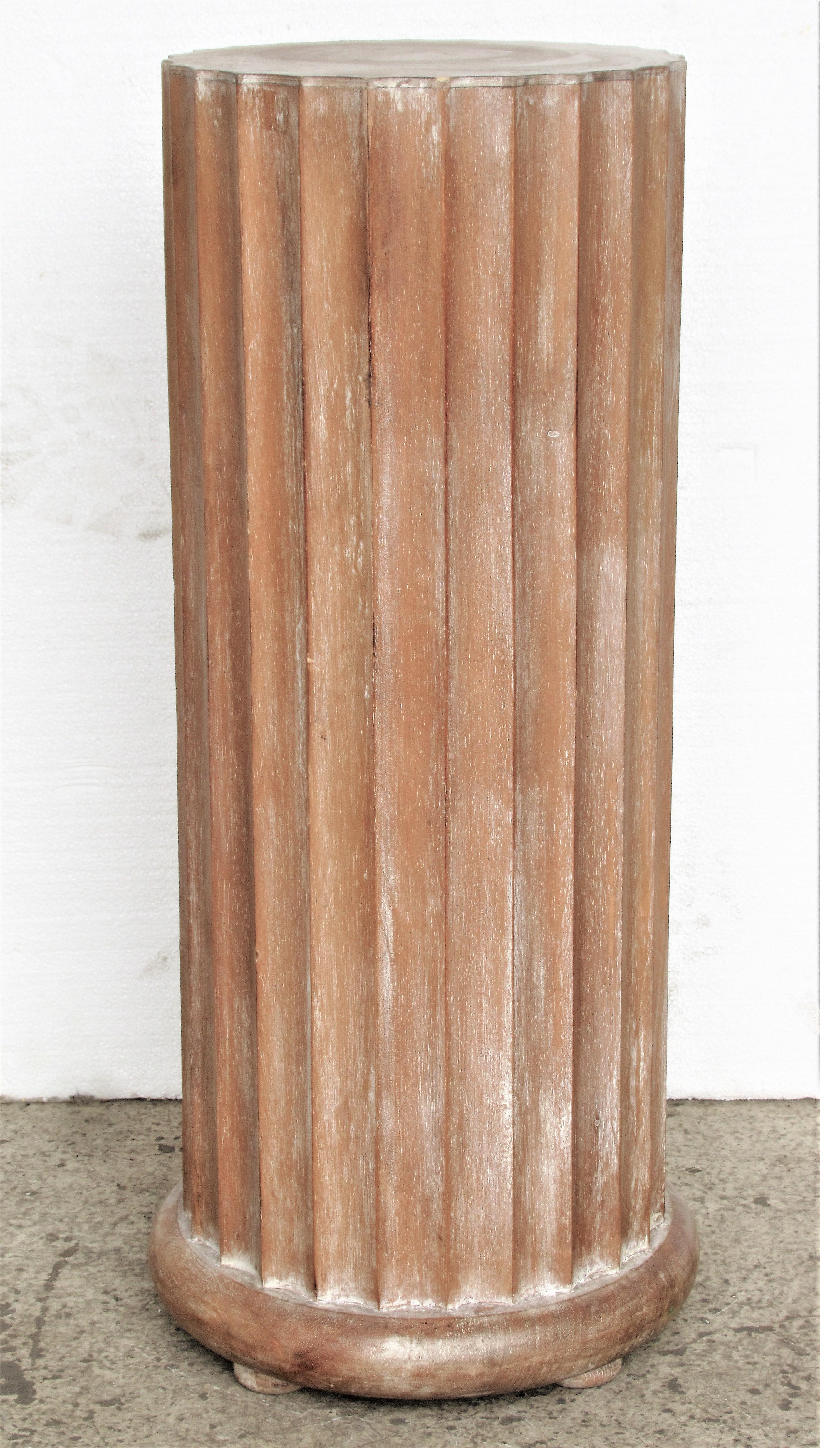 Classical style fluted pine column pedestal raised on four bun feet in all over beautifully aged original pale whitewashed surface. Ink stamped and paper labeled on underside - Made in Italy / Decorative Crafts Inc. / Handcrafted Imports, circa