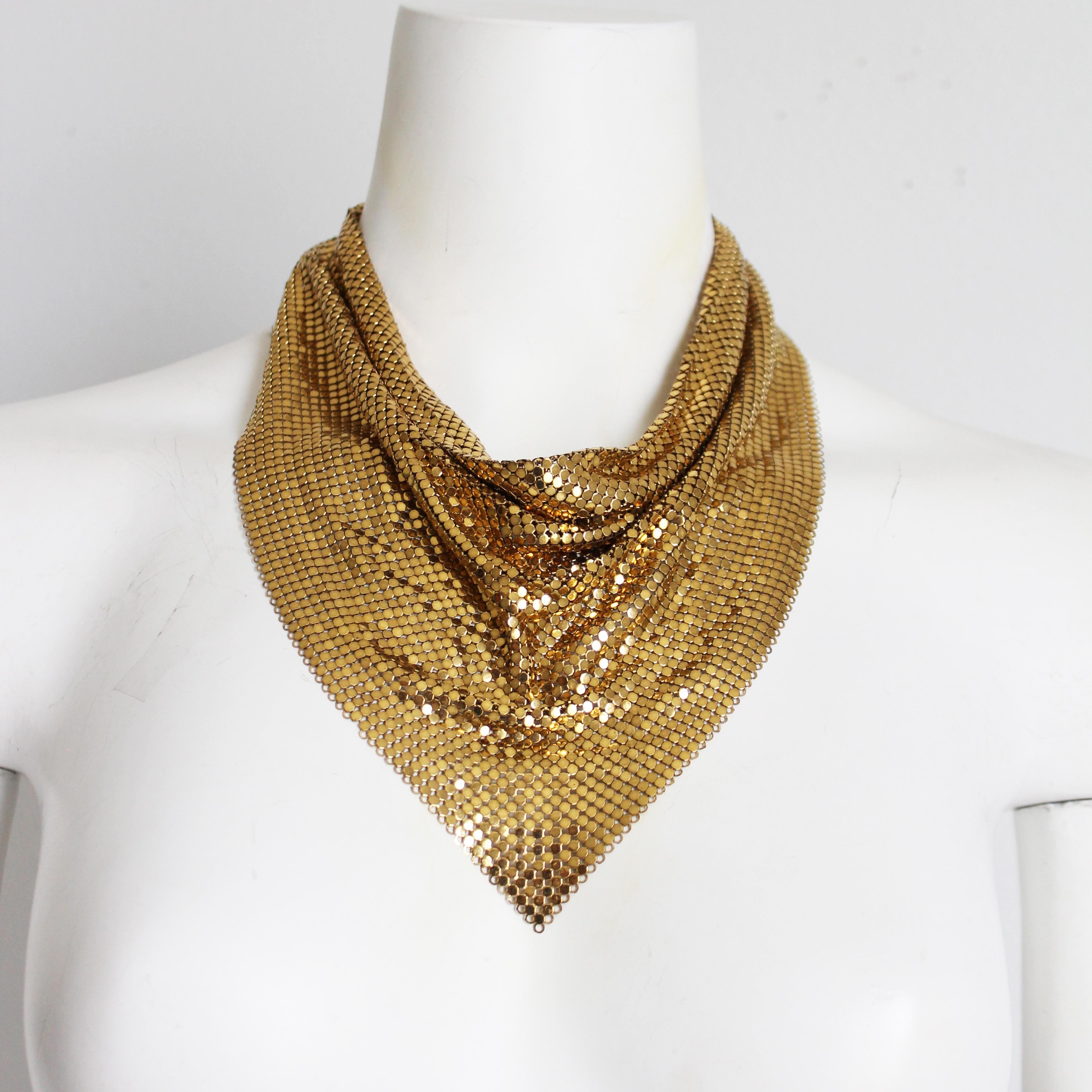 Preowned, vintage bib necklace, made by Whiting and Davis, most likely in the 80s.  Made from their signature flat mesh in gold, it fastens with a small hook and extender chain.

Perfect for parties and celebrations, this iconic jewelry piece