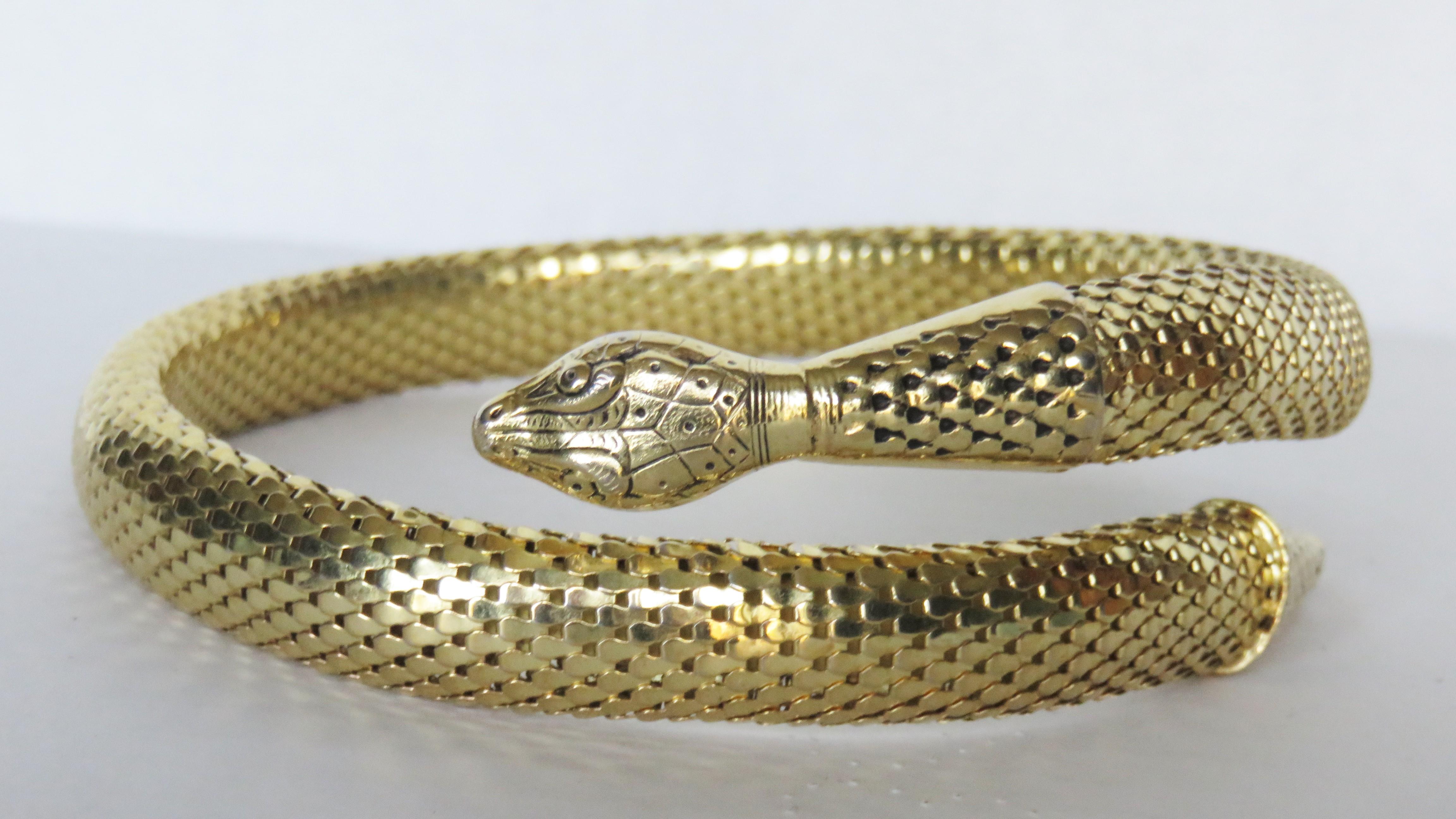 A fabulous adjustable gold metal serpent snake choker and screw back serpant head earing set from Whiting & Davis.