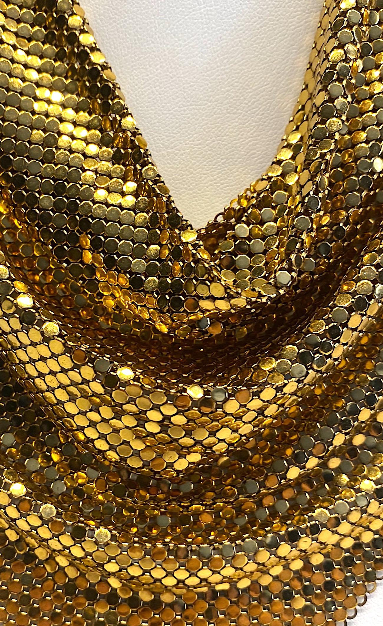 Perfect for twirling the night away at the disco. Whiting & Davis gold mesh handkerchief necklaces was often seen adorning the necks of celebrities at Studio 54 and chic parties in LA. The necklace has a rich gold patina in perfect condition. It is