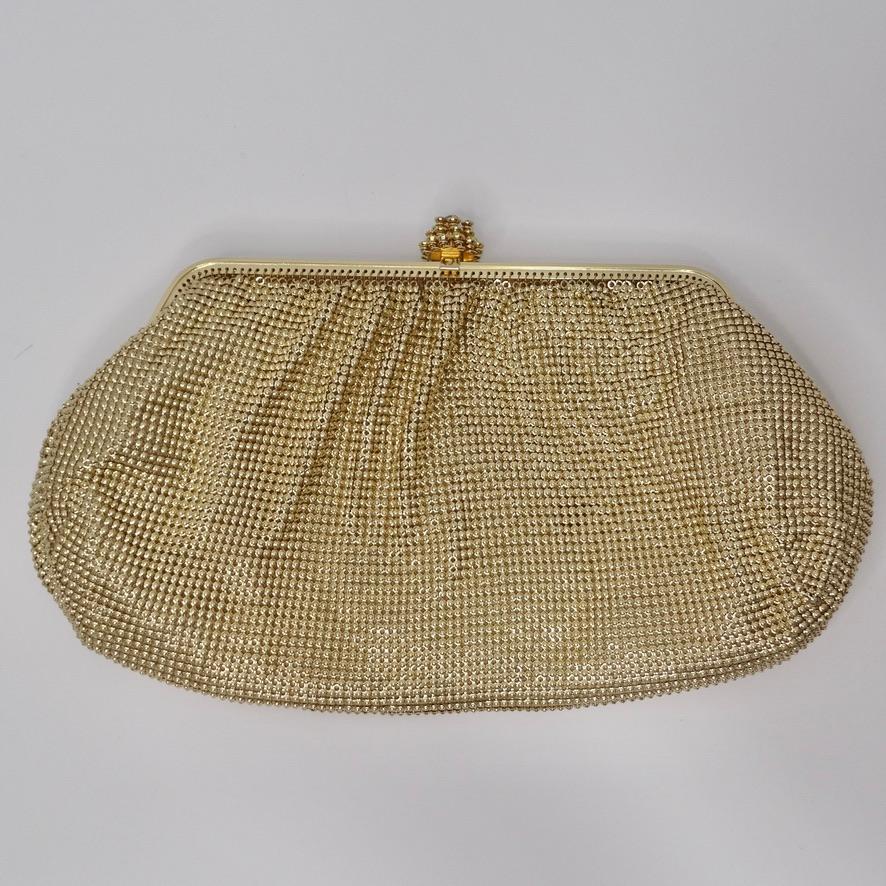 Adorable vintage Whiting & Davis gold chainmail clutch! Complete your going out look effortlessly with this timeless and versatile chainmail clutch. Features a gorgeous rhinestone-encrusted clasp-fastening closure with a detachable strap which
