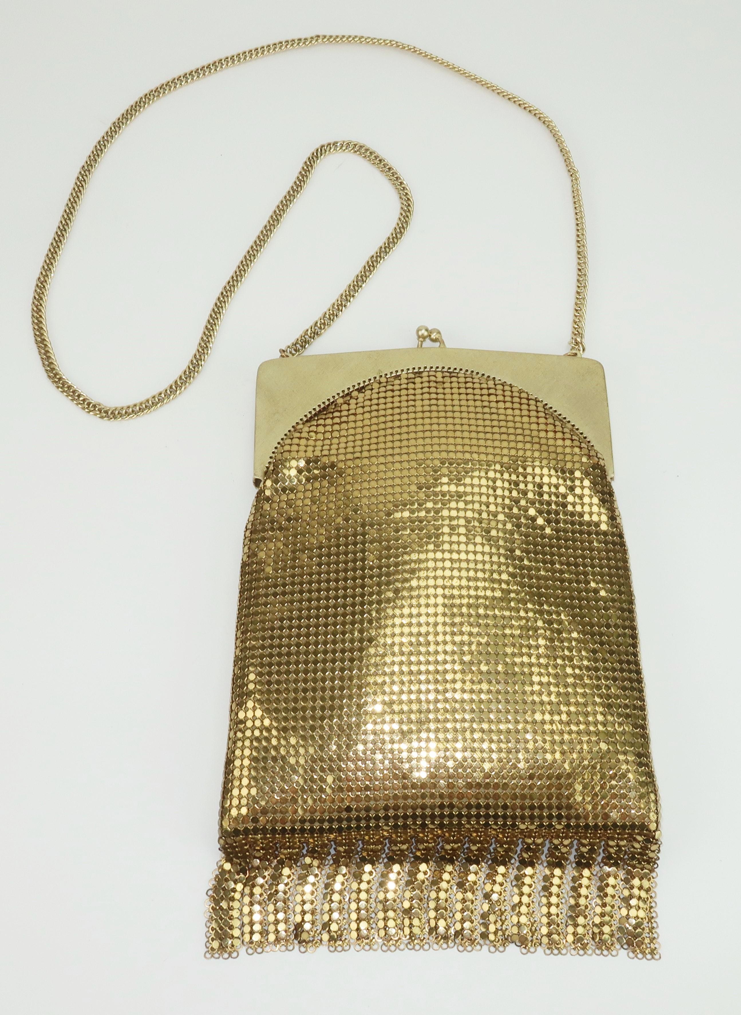 This 1960's mod evening gold mesh handbag by Whiting & Davis will take you from deco to disco!  Whiting & Davis has been producing fashionable handbags since the late 1800’s and their gold mesh designs represent classic American glamour.  The Art