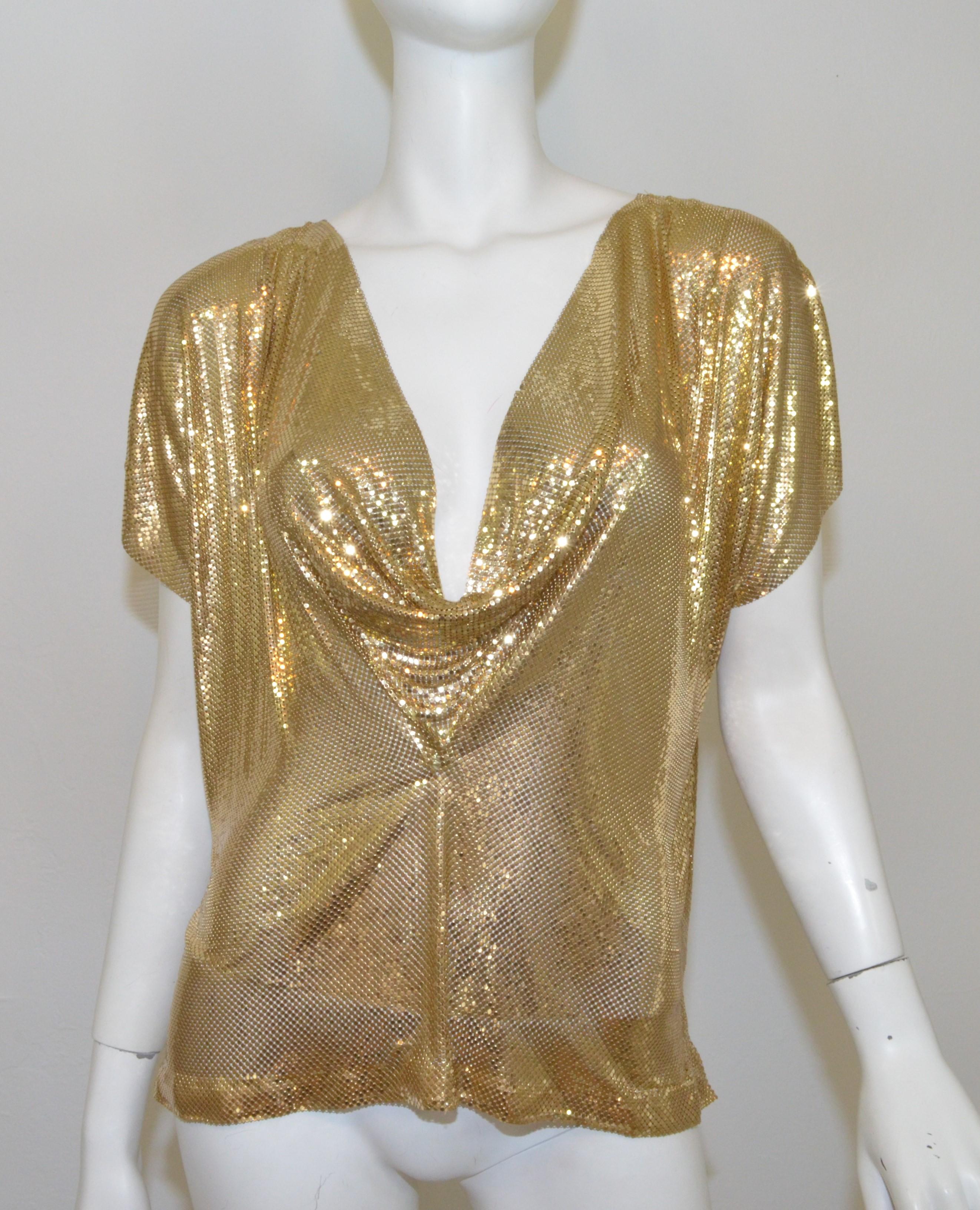 Whiting & Davis Gold Mesh Metal top features a cowl neckline that can also be worn reversed. Top is in great vintage condition with a slight smoke smell and a small unlinked spot/hole as pictured.

Measurements:
Bust - 42”
Length - 21”