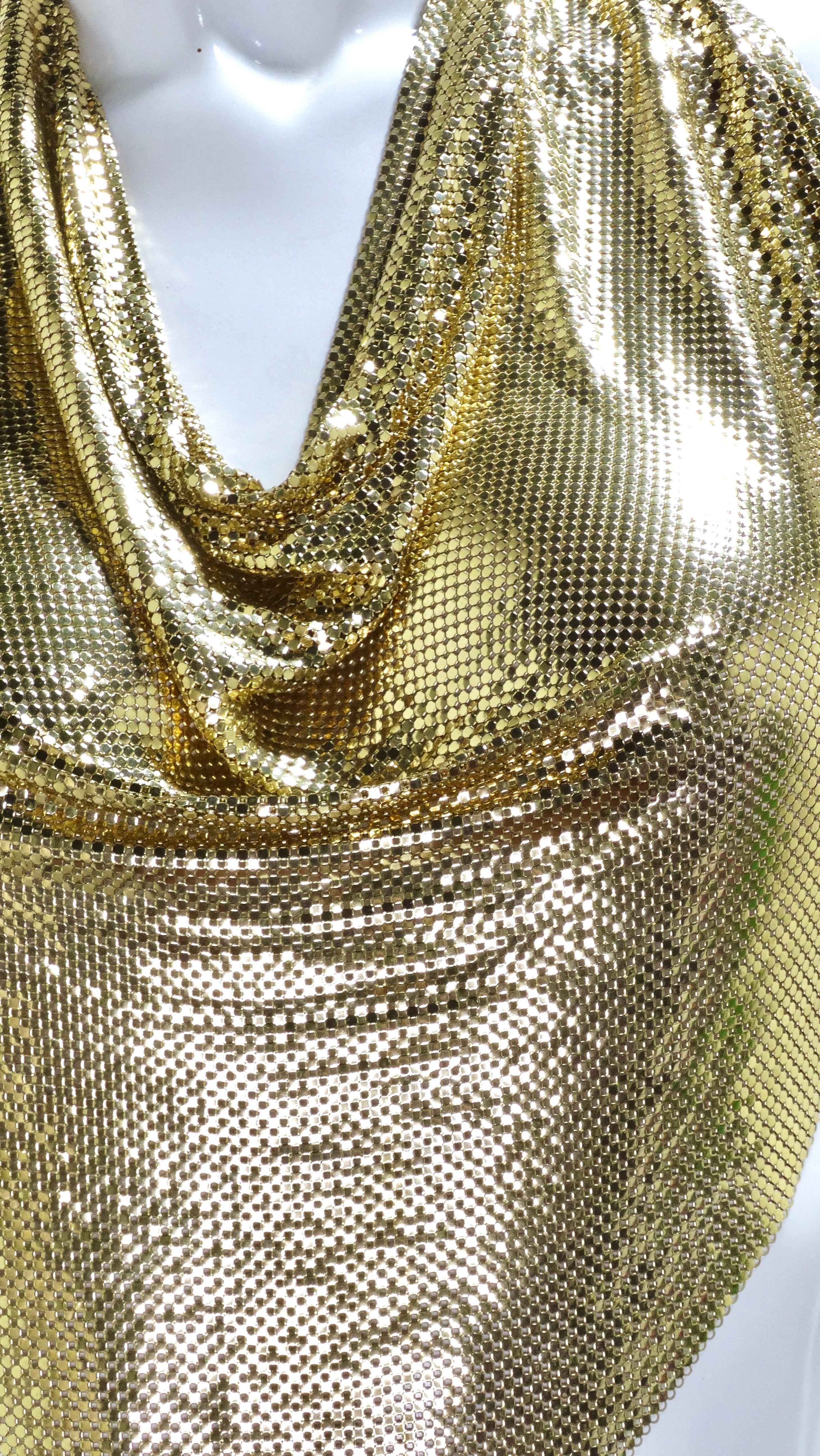 This top is jaw-dropping! Bring the 70's into 2020 and have fun with styling this top as it can be worn in so many different ways. It is sultry with the minimal fabric and completely open back as well as glamorous with the gleaming gold metal mesh