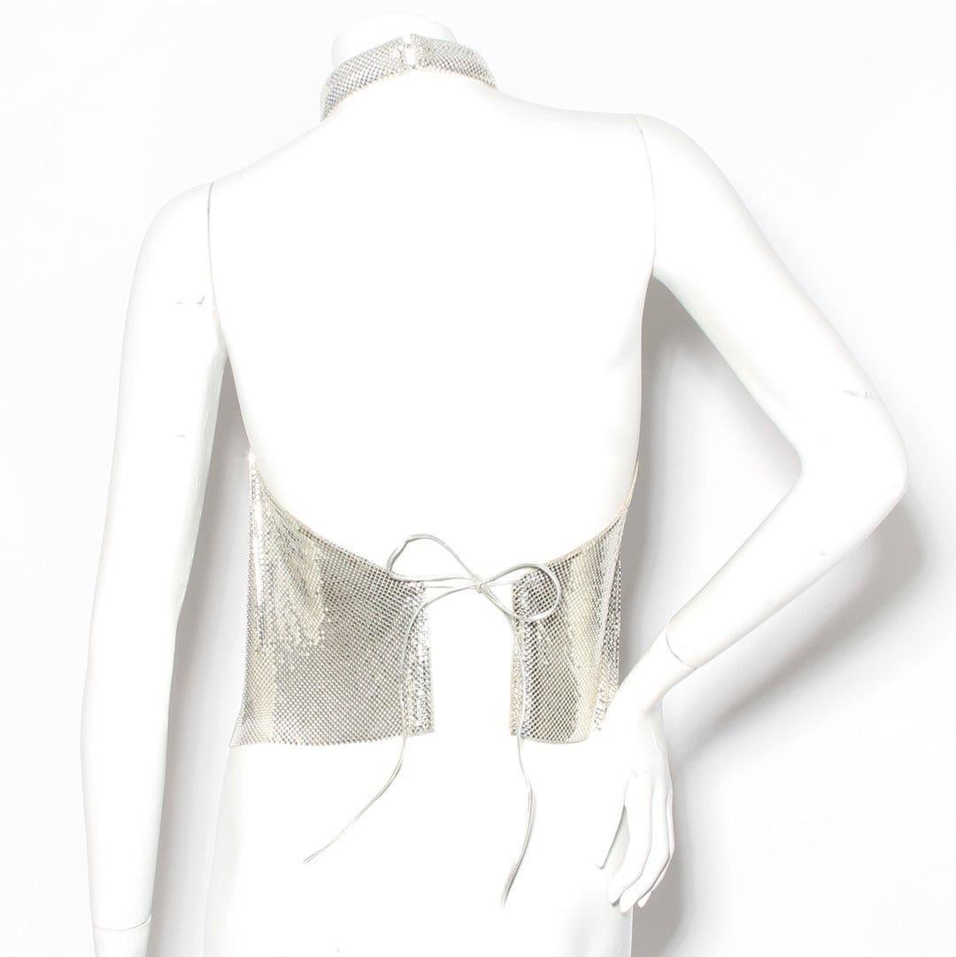 Mesh silver halter top by Whiting & Davis
Silver metal mesh 
Hook and eye neck closure 
Metallic coated string ties in back
Made in the U.S.A.

Condition: Excellent vintage condition, little to no visible wear. (see photos) 
Size/Measurements: