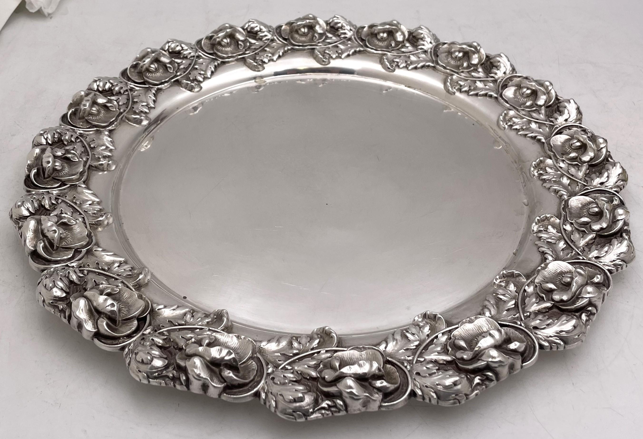 Whiting sterling silver round tray in Art Nouveau style from the early 20th century, adorned with three dimensional anemones and natural motifs. It measures 14 1/2'' in diameter by 1'' in height, weighs 39.2 troy ounces, and bears hallmarks as