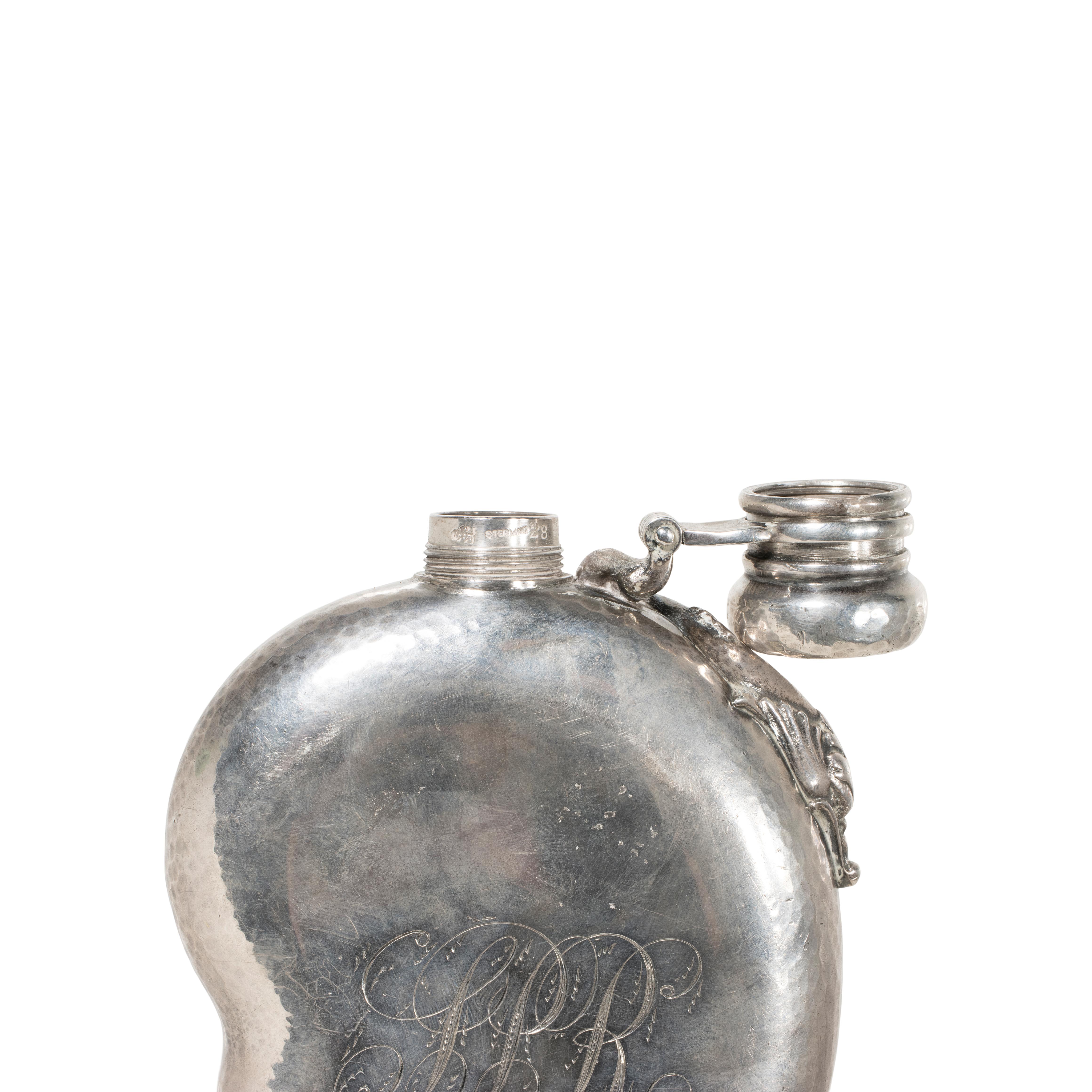 Whiting sterling silver flask. Woman in a wave on front, dolphin near hinge, monogrammed with date on back, and hammered on sides and cap. 6 1/4