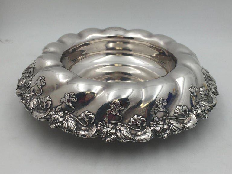 Whiting sterling silver table centerpiece/ fruit bowl decorated with gorgeous, dimensional leaf and flowers motif all around the rim in Art Nouveau style from 1905. It measures 14.1 inches in diameter by 3.8 inches in height, weighs 32.2 ozt, and