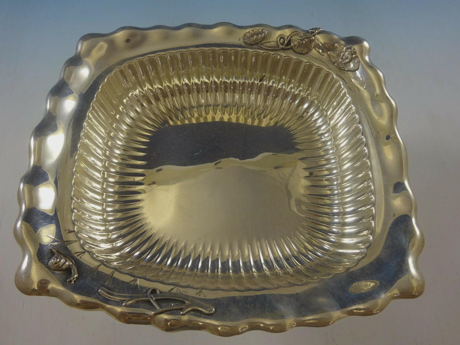 Whiting
Whiting sterling rectangular bowl with beautiful ruffled edge and interior fluting. It features an applied frog, snail, branch, and lily pads with flower. It's marked with #2048. The bowl measures 1 1/2