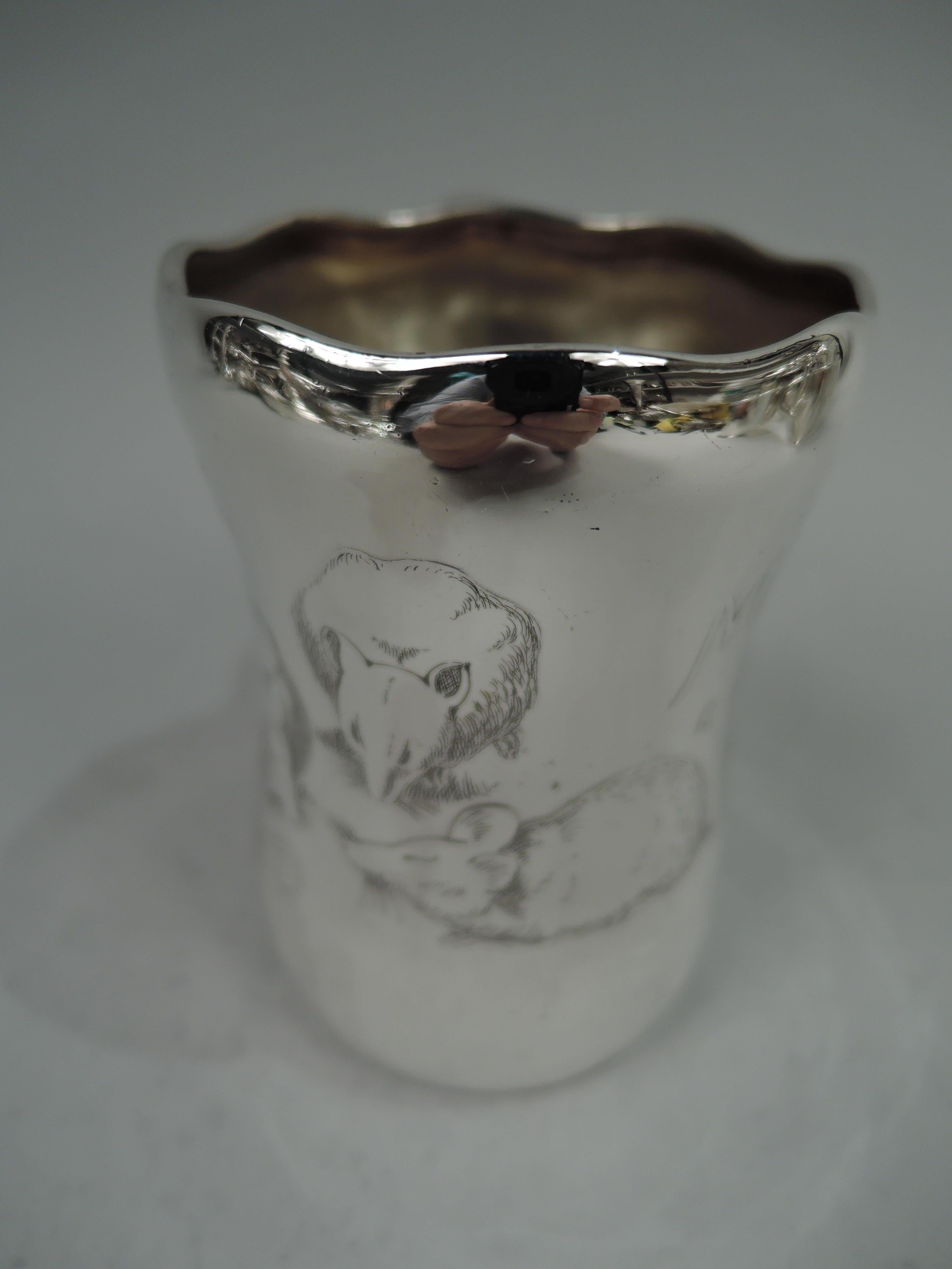 Art Nouveau sterling silver nursery rhyme baby cup. Made by Whiting in New York, ca 1900. Tall and waisted bowl with wavy rim and c-scroll handle with splayed trefoil mount and baluster tail. Engraved depiction of the Three Blind Mice, sightless