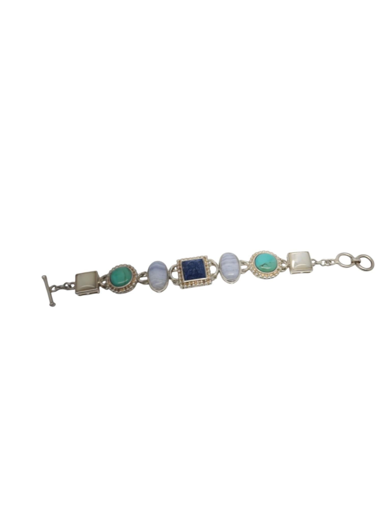 Whitney Kelly Sterling Carved Lapis Bracelet -

This unique bracelet by Whitney Kelly features a carved lapis center with agate, turquoise, and mother of pearl set in classic sterling silver.

Size: approx. 8 in.

Stamped: WK 925 CHINA

Weigh: 33.2