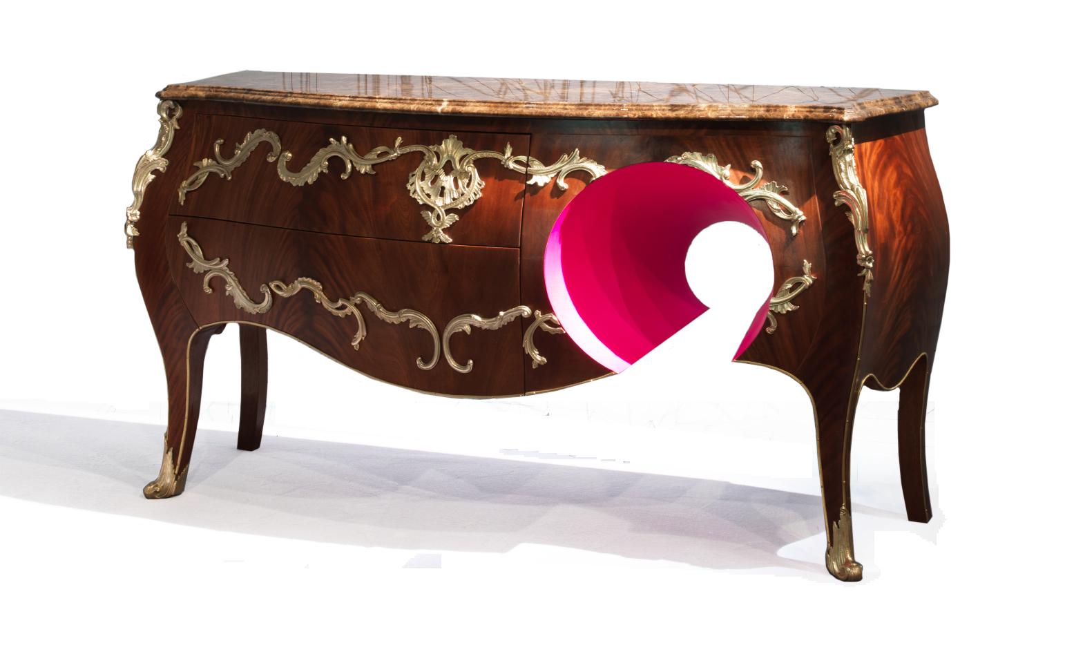 Crafted with meticulous attention to detail, this masterpiece, covered in mahogany feather finish, pays homage to the delicate and harmonious style of Louis XV.

Within the sinuous curves and rich curls lie brass decorative details inspired by the