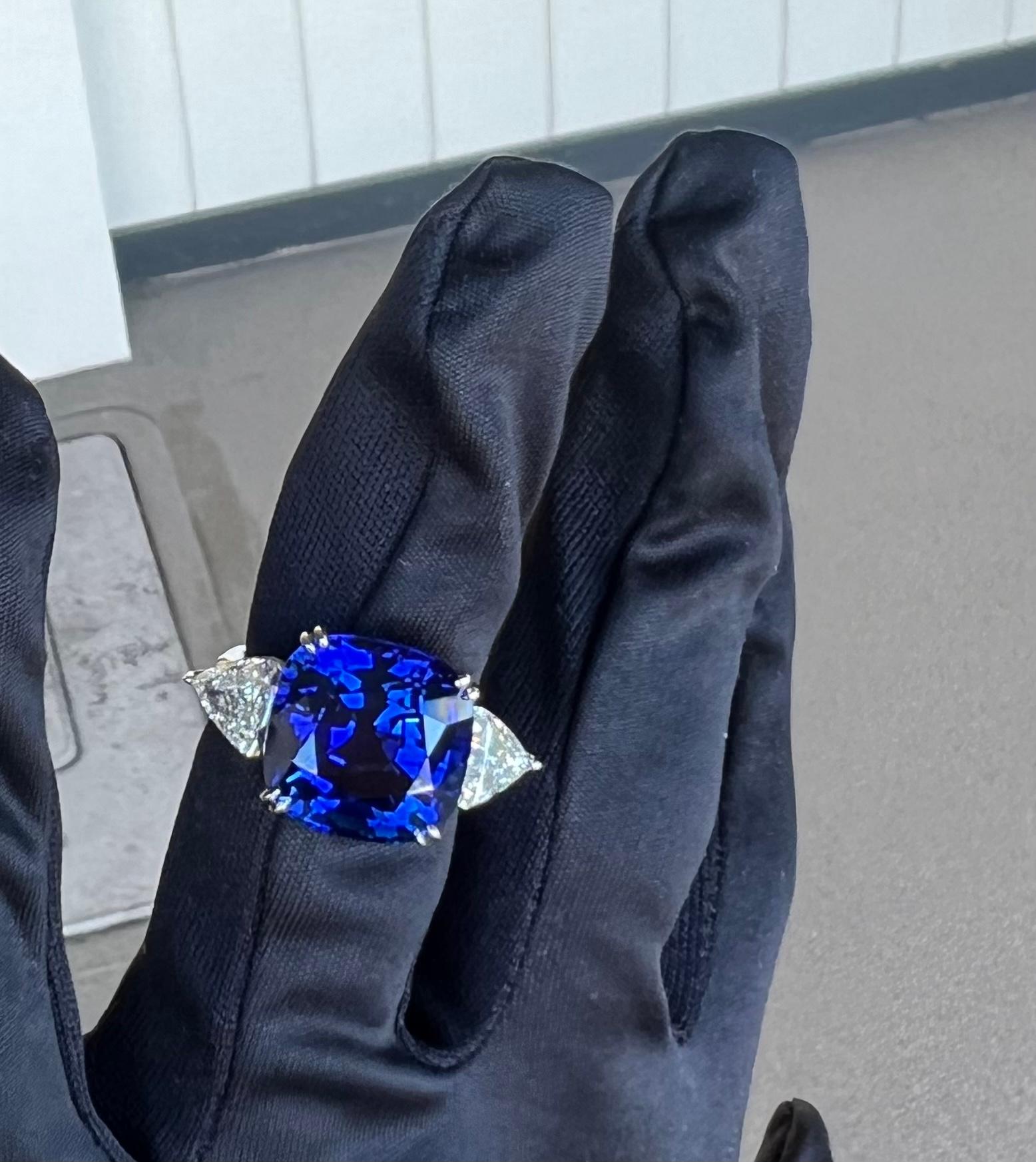 Stupendous and very significant, 21.12 carat estate GIA Certified huge brilliant cut natural corundum blue sapphire and diamond ring is set in platinum. This is the most incredible sapphire in person with the most intense royal blue color with
