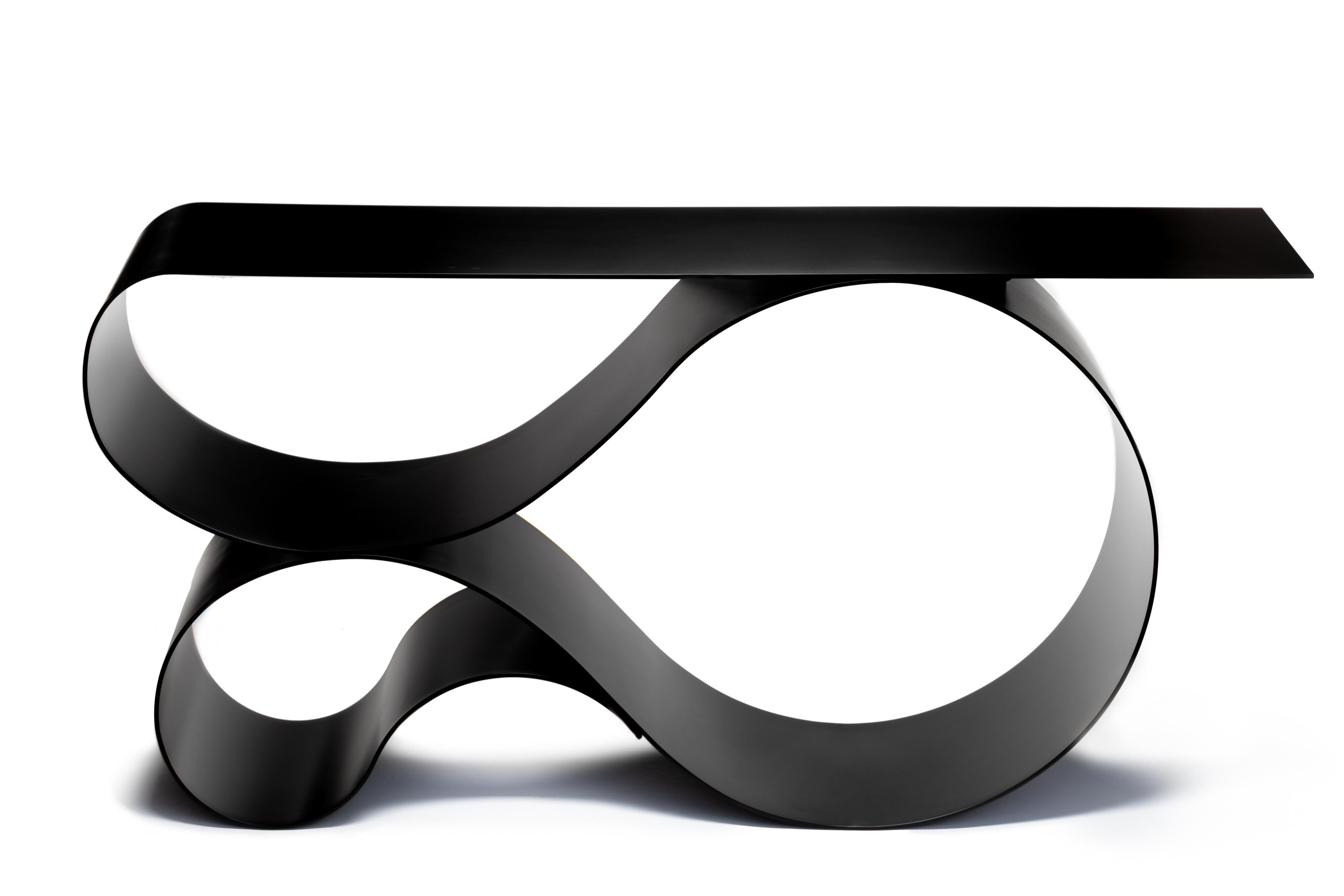Whorl console in black matte powder coated aluminum by Neal Aronowitz Design
Dimensions: D 43.2 x W 160 x H 76.2 cm
Materials: Powder coated aluminium.
Size, colors and finish can be modified and customized. 

An elegant and powerful sculptural