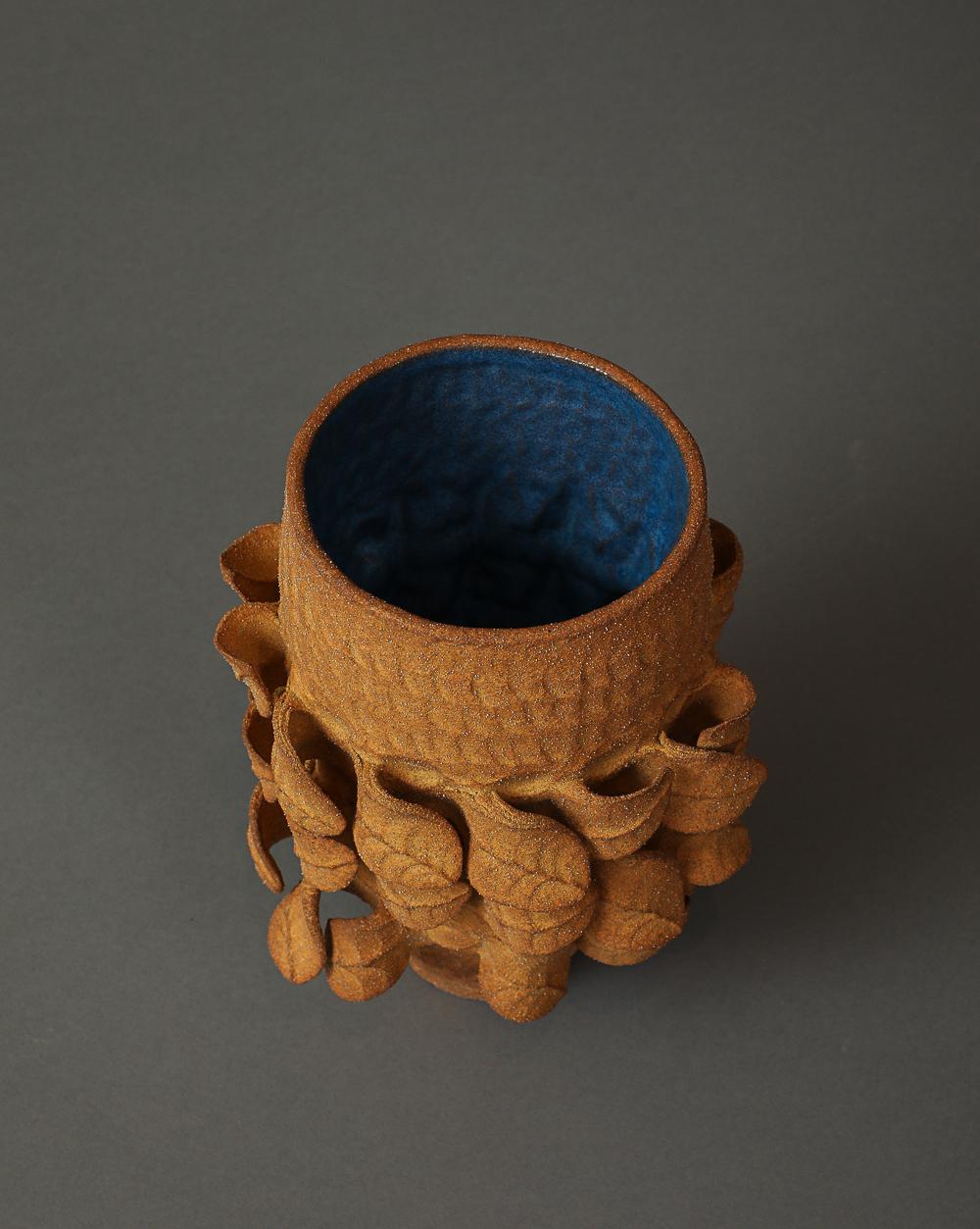 Hand-built and pinched pot with unglazed terracotta exterior and shiny cobalt blue interior.
Signed with artist’s cipher.
American, c. 2024