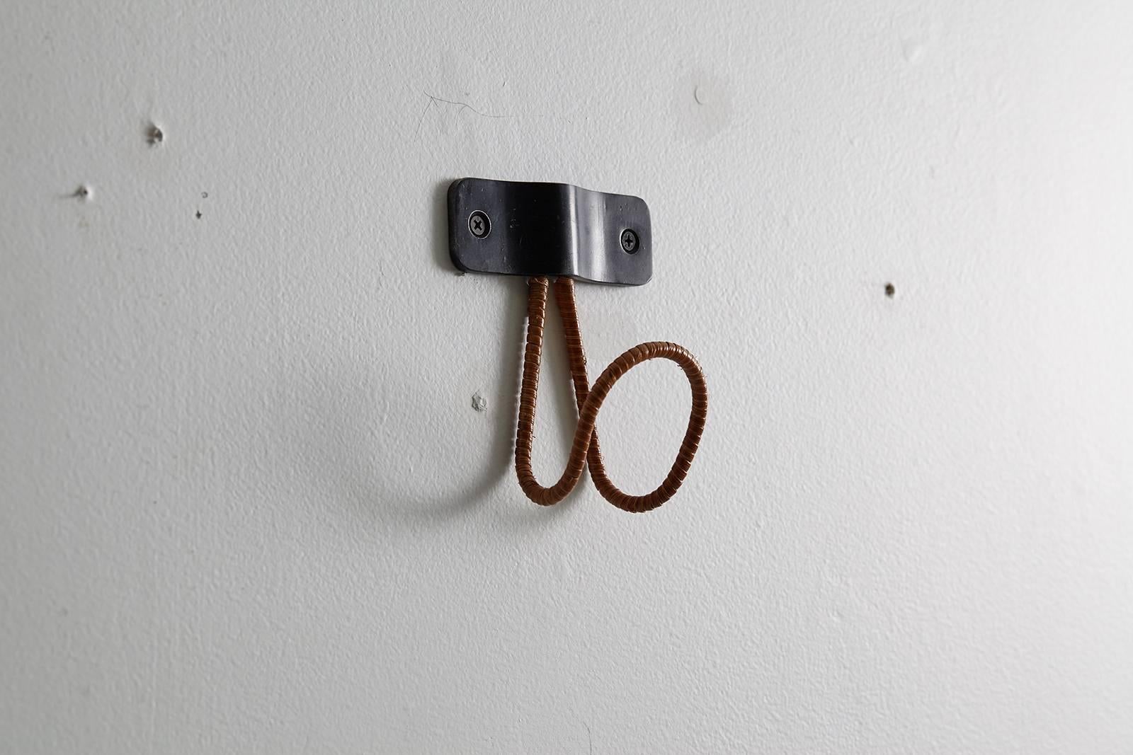 Iron and wicker coat hook by Orange Furniture. Made-to-order. 
Beautiful midcentury style! 

Four in stock.