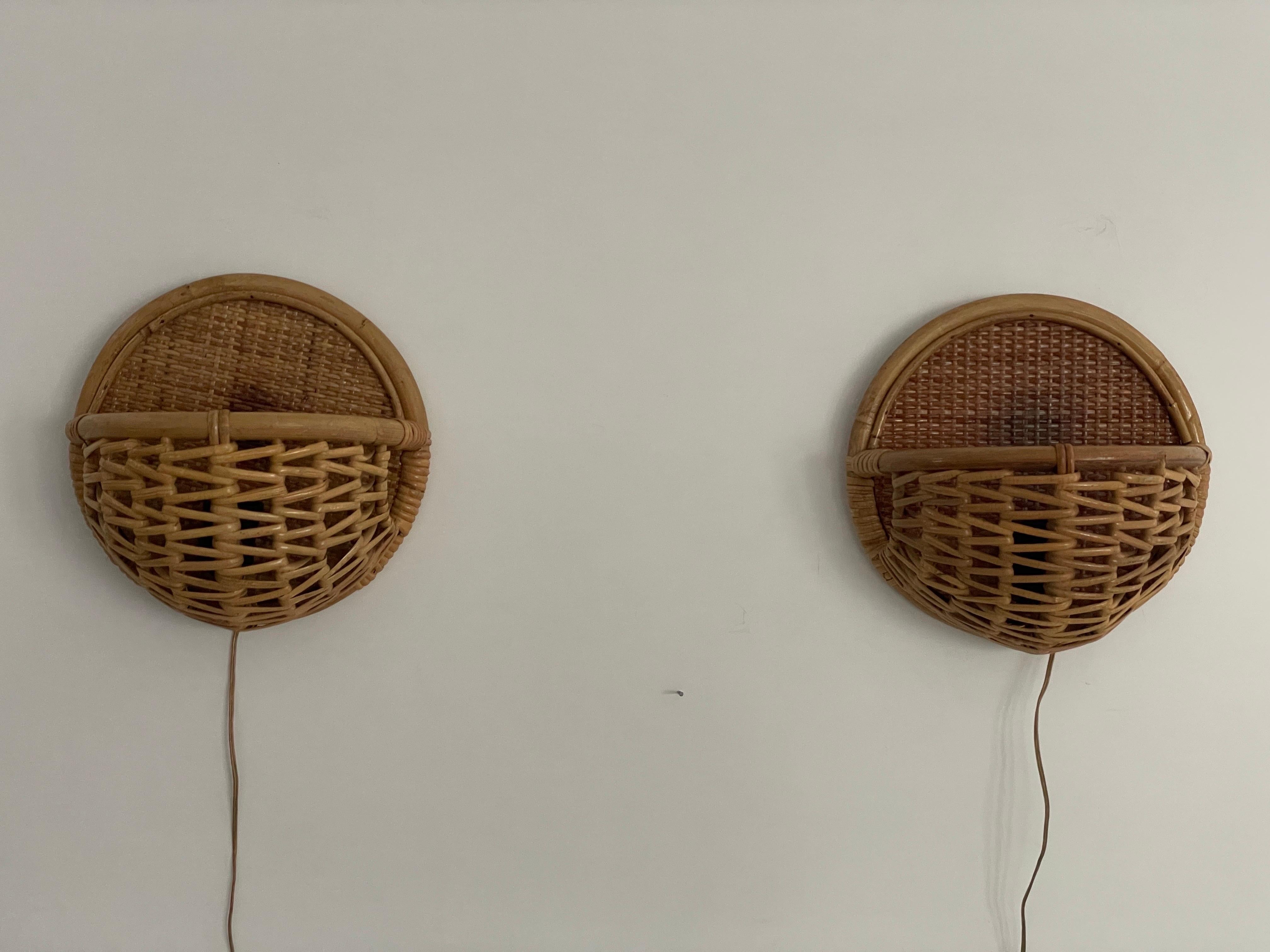 Wicker and Bamboo Round Design Pair of Wall Lamps, 1950s, Italy

Very elegant and Minimalist wall lamps
Lamp is in very good condition.

These lamps are plug-in but they can be easily converted to hardwired. We will do this conversion if you