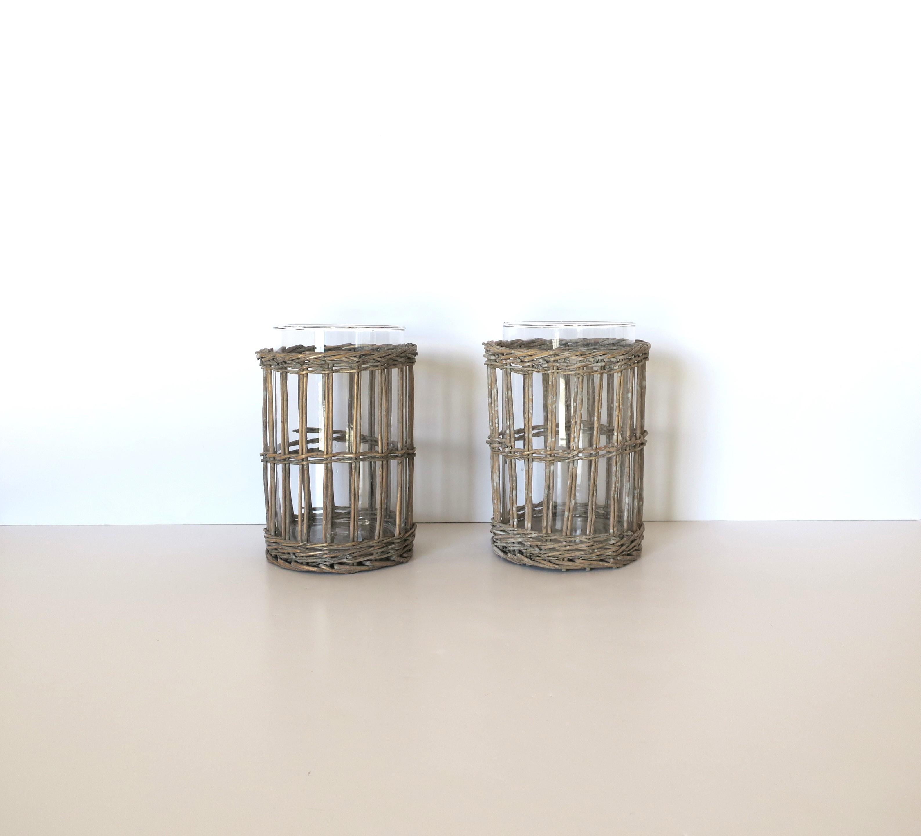 Wicker and Glass Hurricane Candle Lamps, Pair In Good Condition For Sale In New York, NY