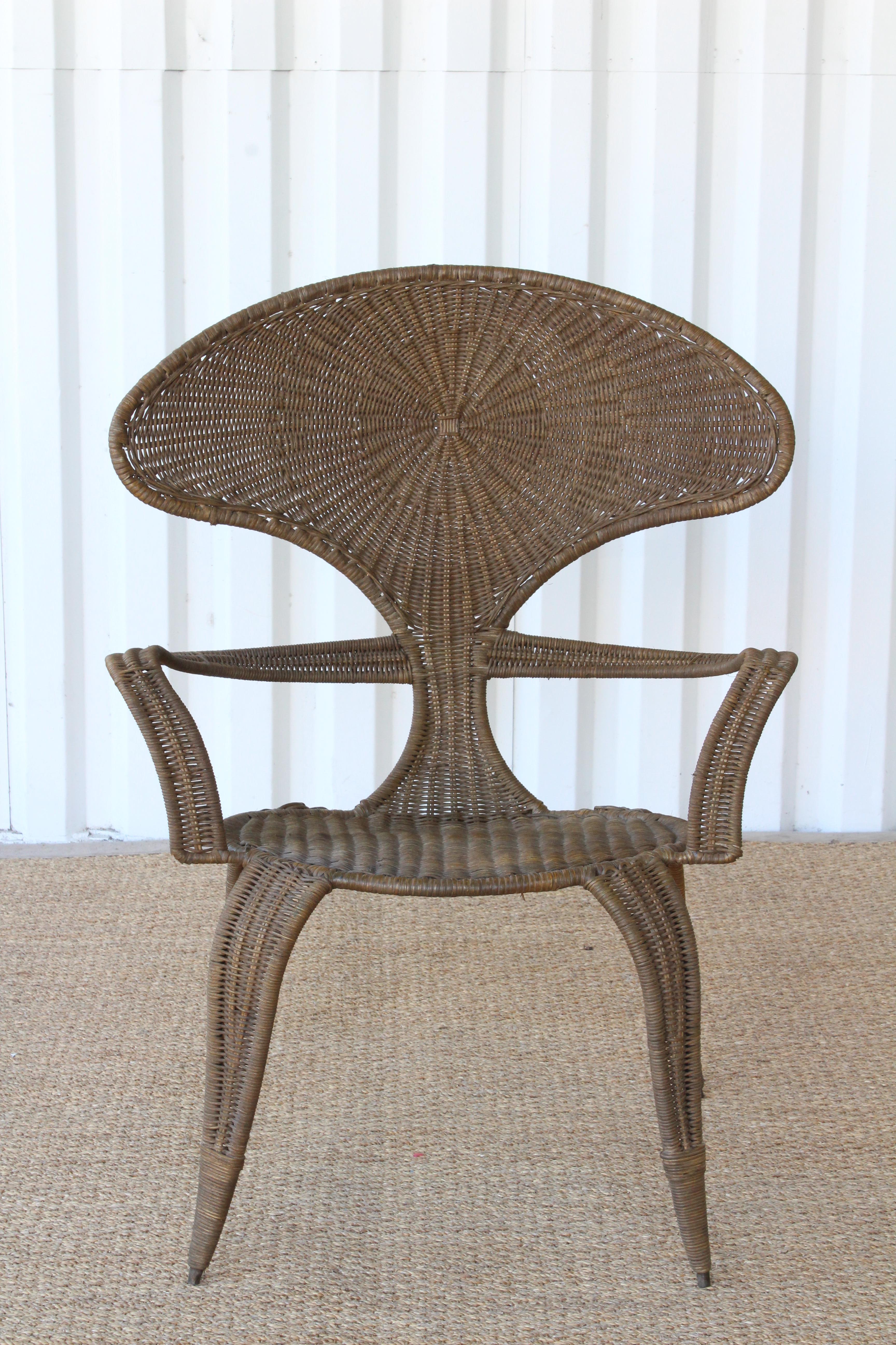 Vintage iron framed chair with new wicker, designed by Danny Ho Fong for Tropi-Cal. 