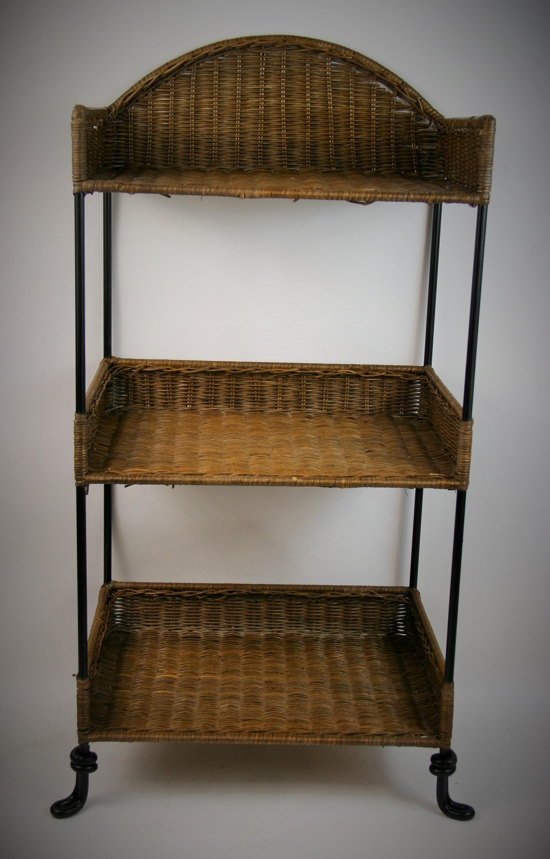 2-301 Wicker and iron 3-tier shelf with shaped feet.
