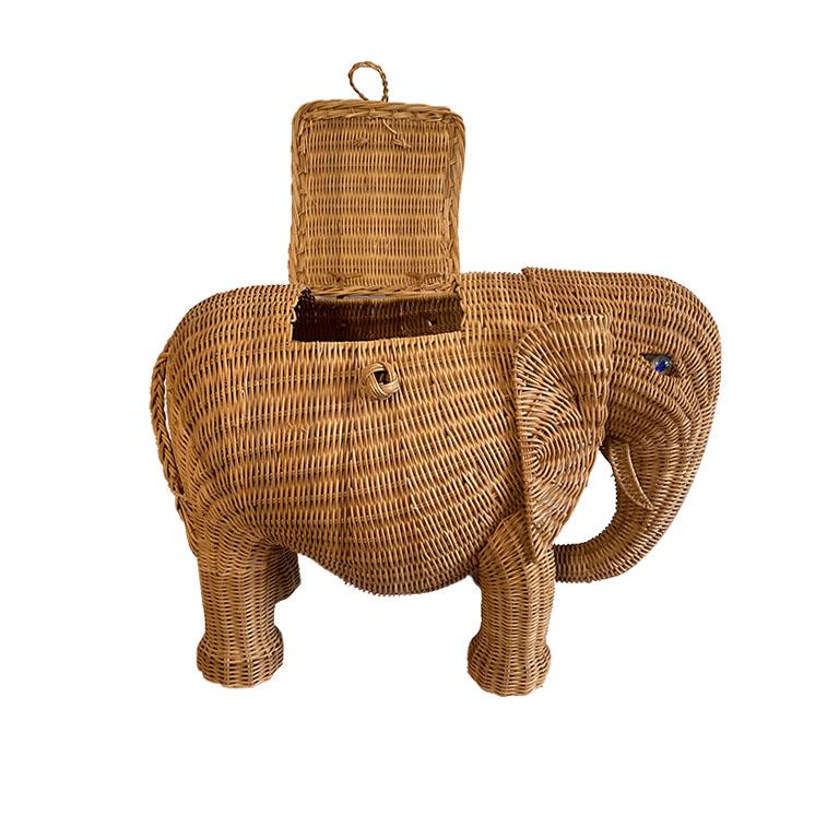 A whimsical wicker elephant basket in the style of Mario Lopez Torres. This basket will be fabulous for a child's room, or for a living room or patio. The top opens making it great for use as extra storage space. The eyes are created from blue and