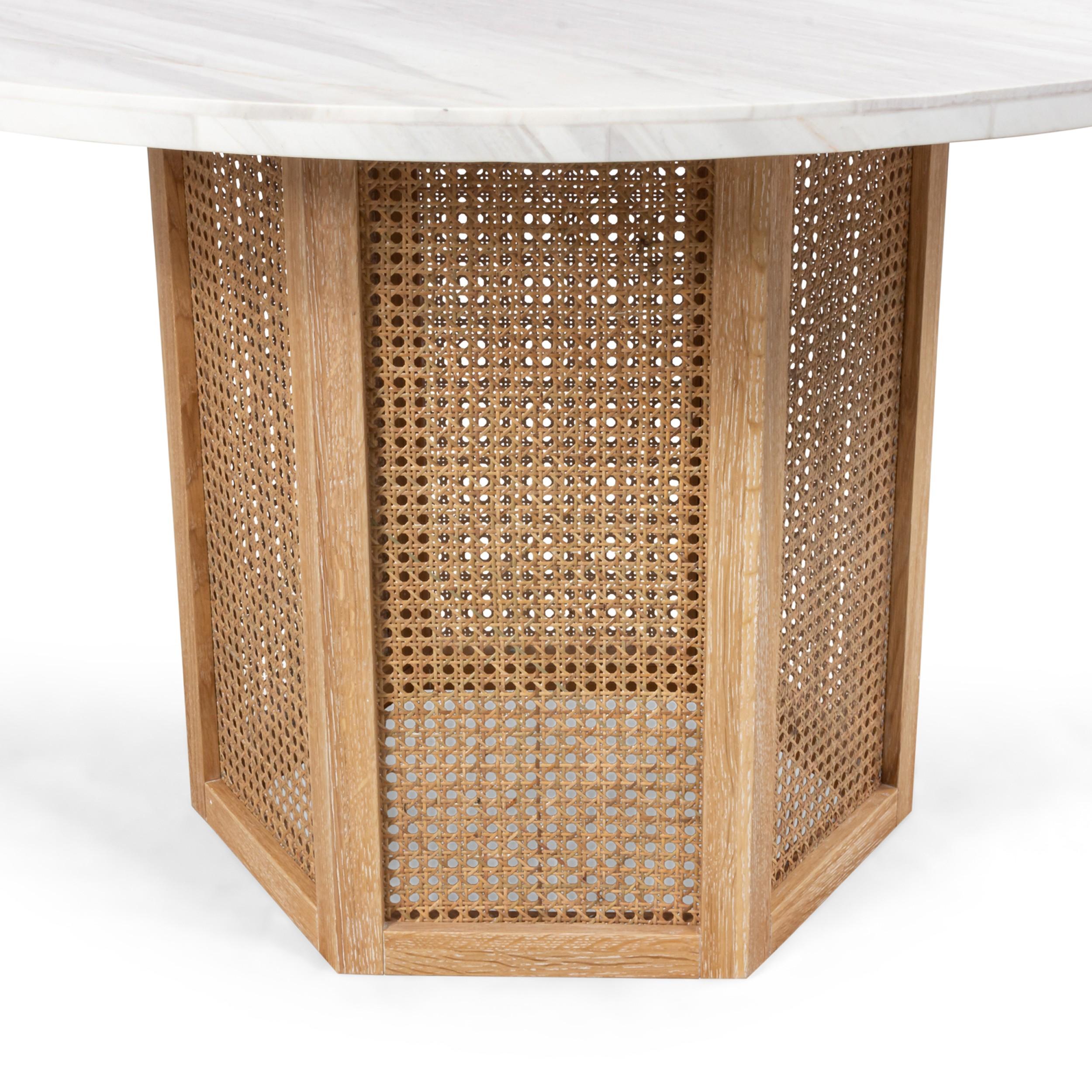 Contemporary center /dining table supported on a 6 sided cerused oak pedestal base with cane panels supporting a round white marble veneer top

