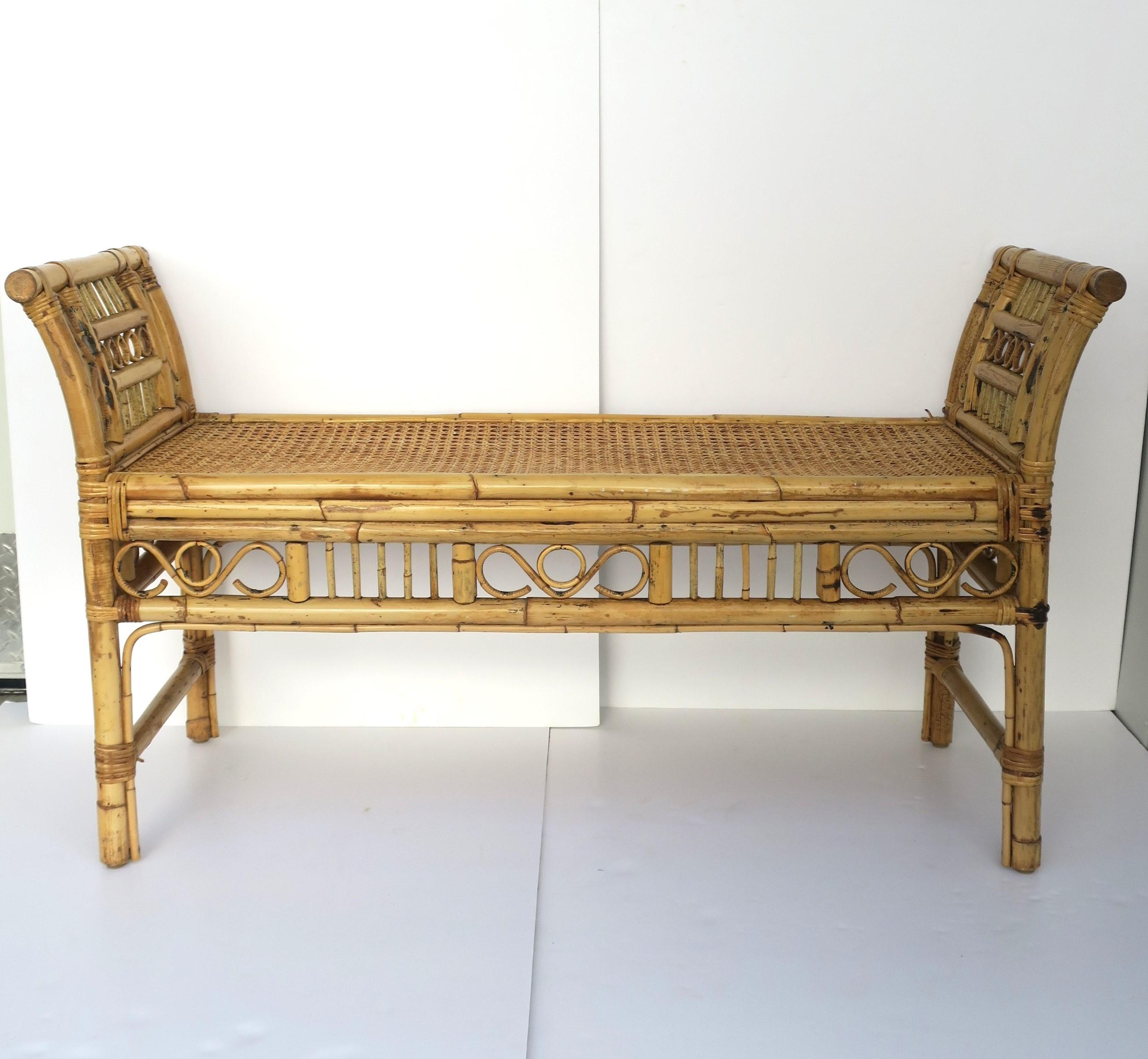 A blonde wicker, bamboo and cane bench in the Chinoiserie style, circa mid to late-20th century. Frame is bamboo, wicker wrapped, with a cane seat. Piece may also work outside providing area is covered, e.g. porch area. 

Dimensions: 
17