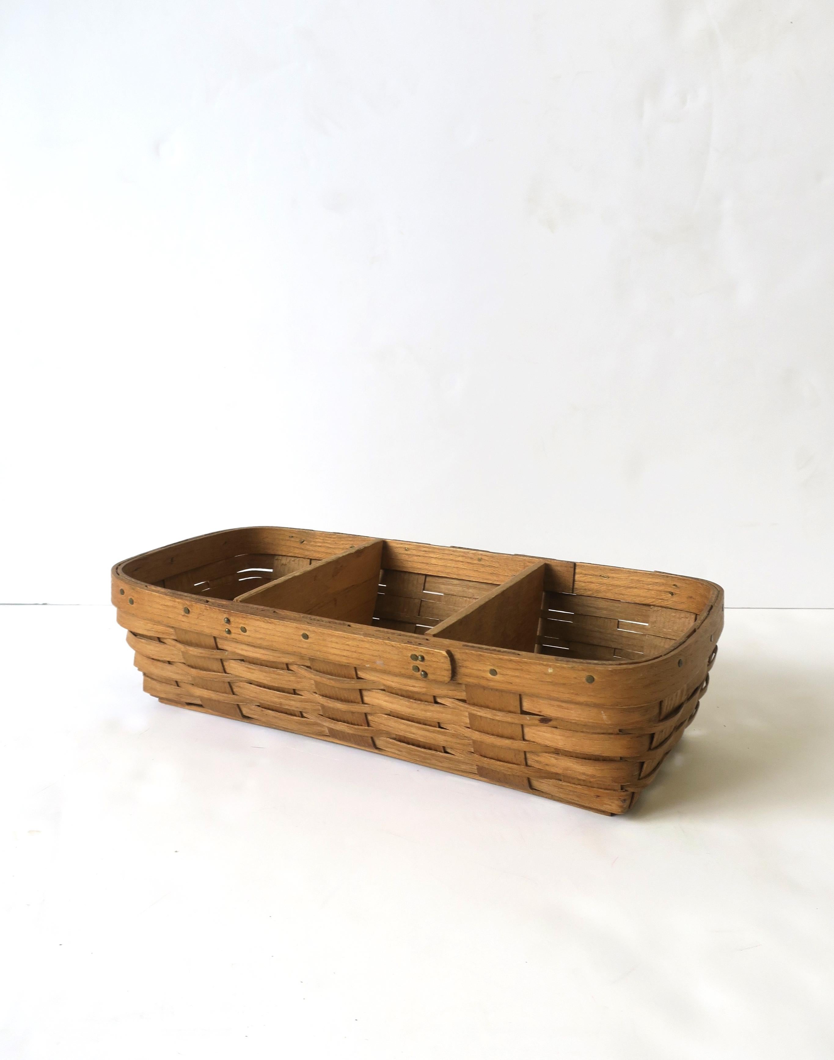 A vintage wicker splint gathering basket with tacked rim, circa late-20th century, USA. A rectangular wicker splint gathering basket for fruits, vegetables, herbs, bread, etc., or, beautiful as a standalone piece. Many uses, as demonstrated.