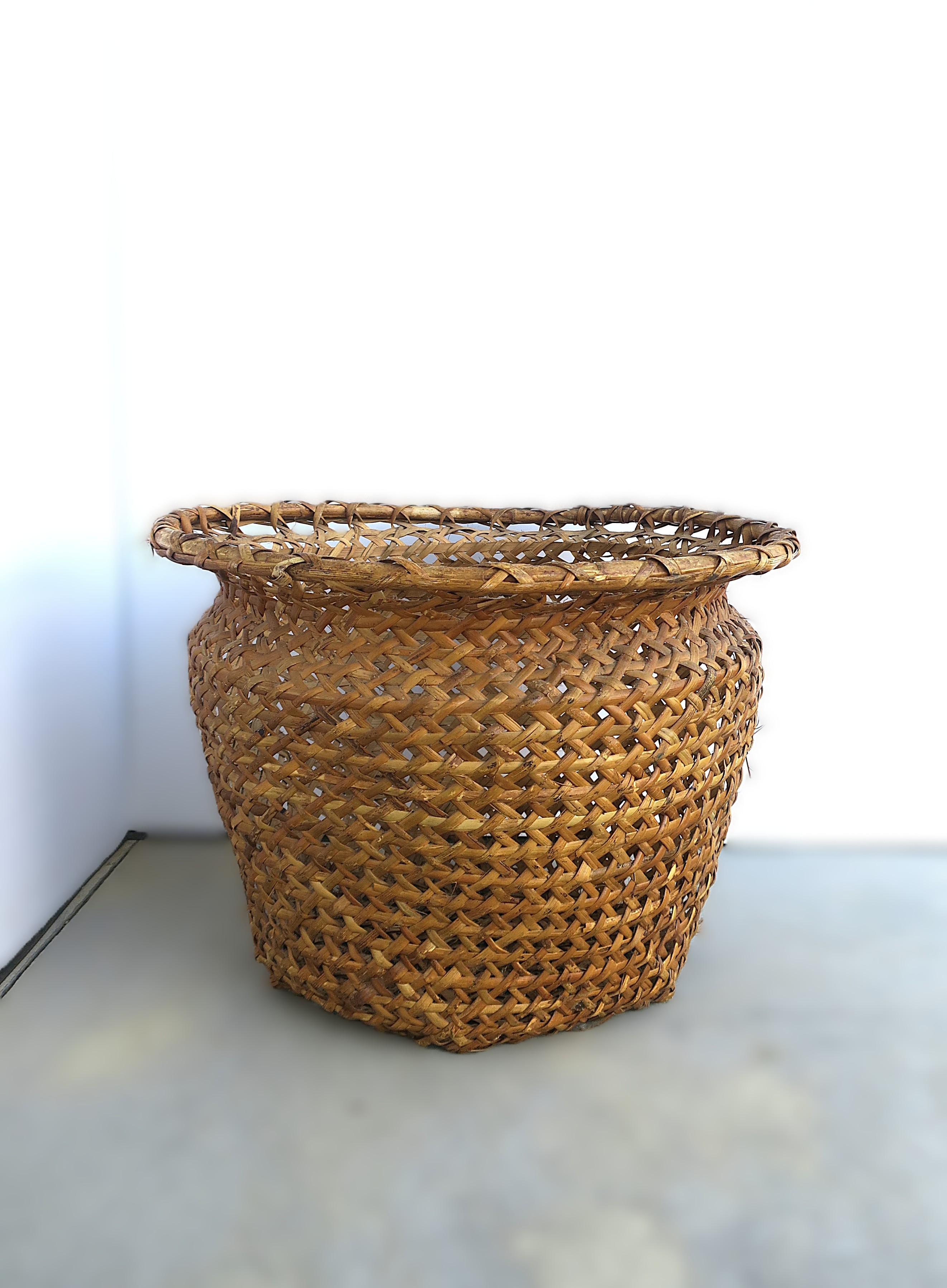 Two (2) available, each sold separately. 

A hand-crafted wicker basket cachepot (plant potholder), circa late-20th century. Use to hold a plant or other item(s). Internal dimensions include 15.5