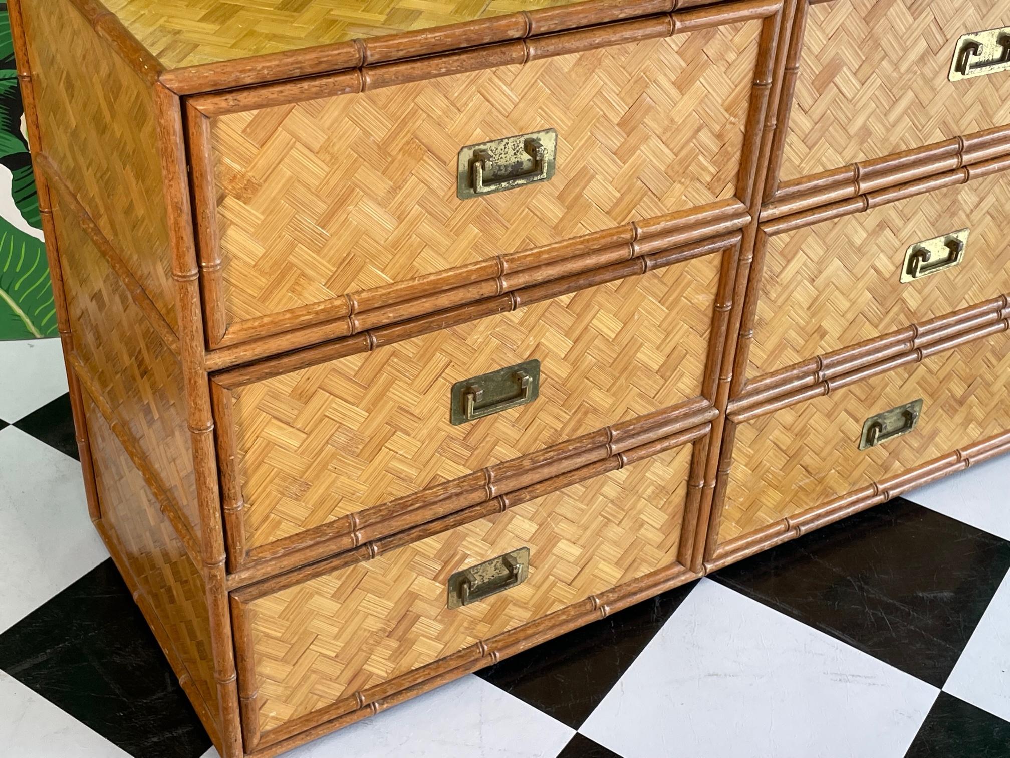 Faux bamboo double dresser with full basketweave cane veneer. Brass campaign style hardware. Good vintage condition with imperfections consistent with age, see photos for condition details.
For a shipping quote to your exact zip code, please message