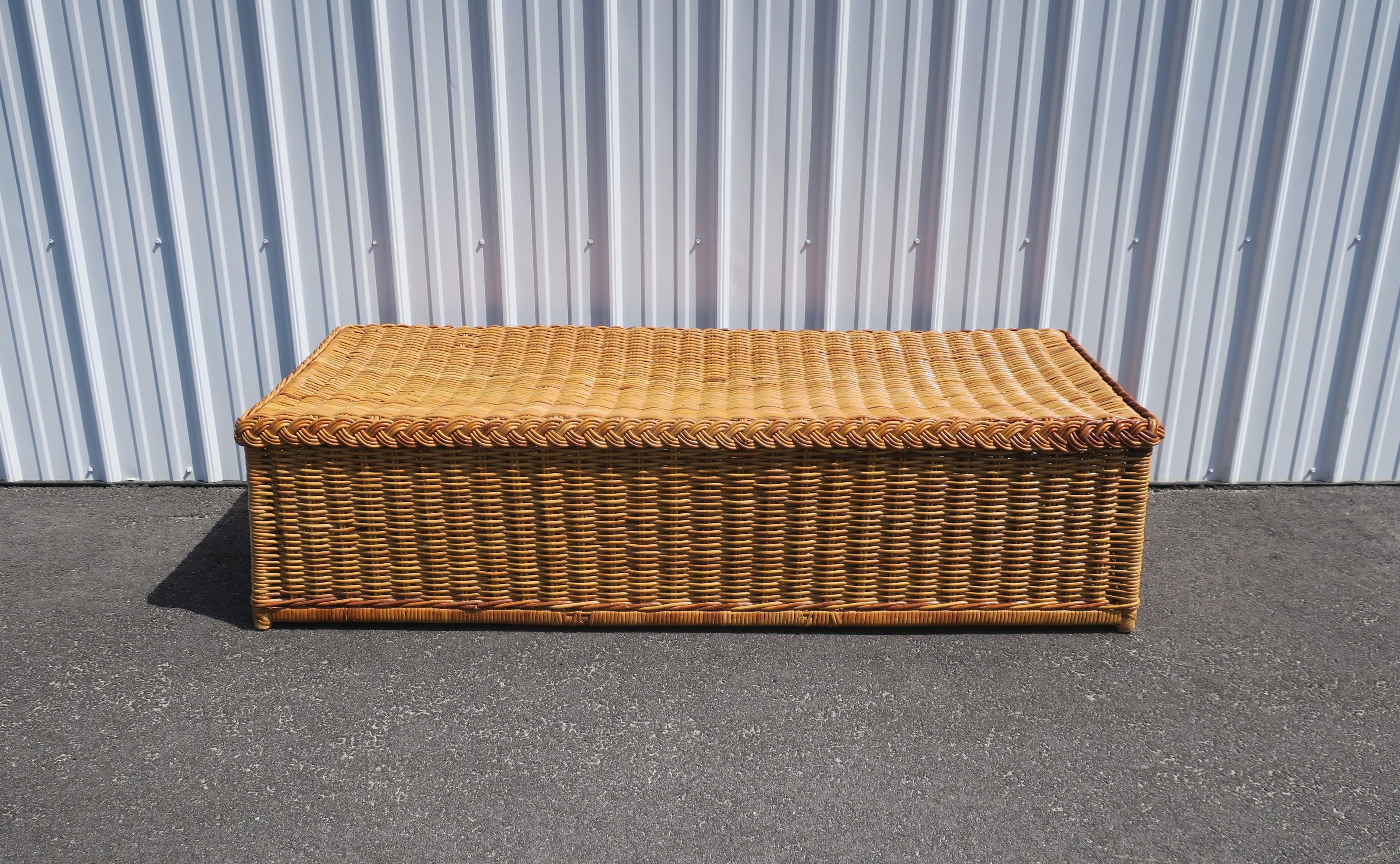A beautiful natural wicker bench with braided edge, in the style of McGuire Furniture Co., circa mid to late-20th century. Bench is spacious, rectangular, with braided edge around, and relatively long at 60
