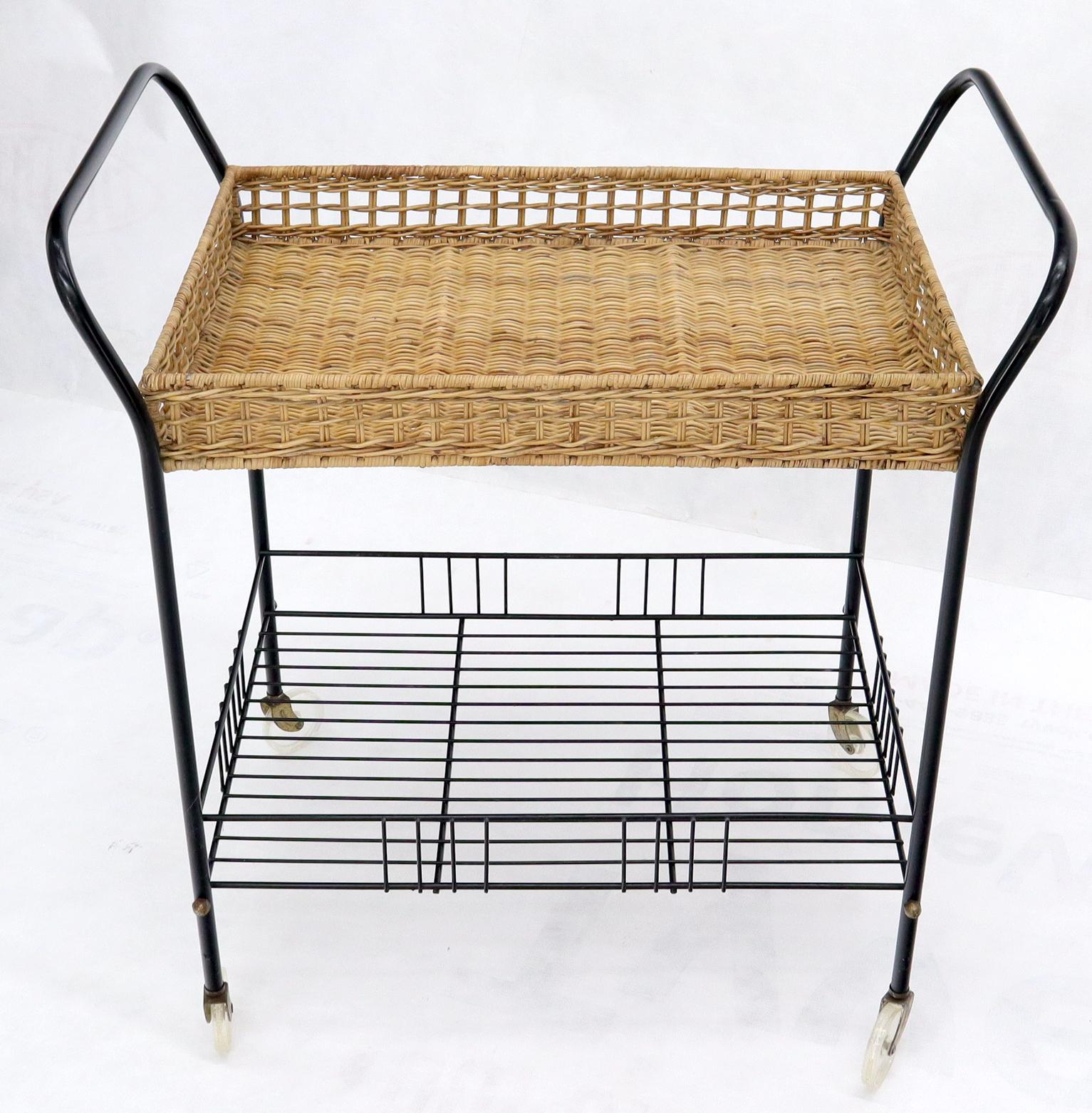 Mid-Century Modern wicker and steel serving cart on wheels.