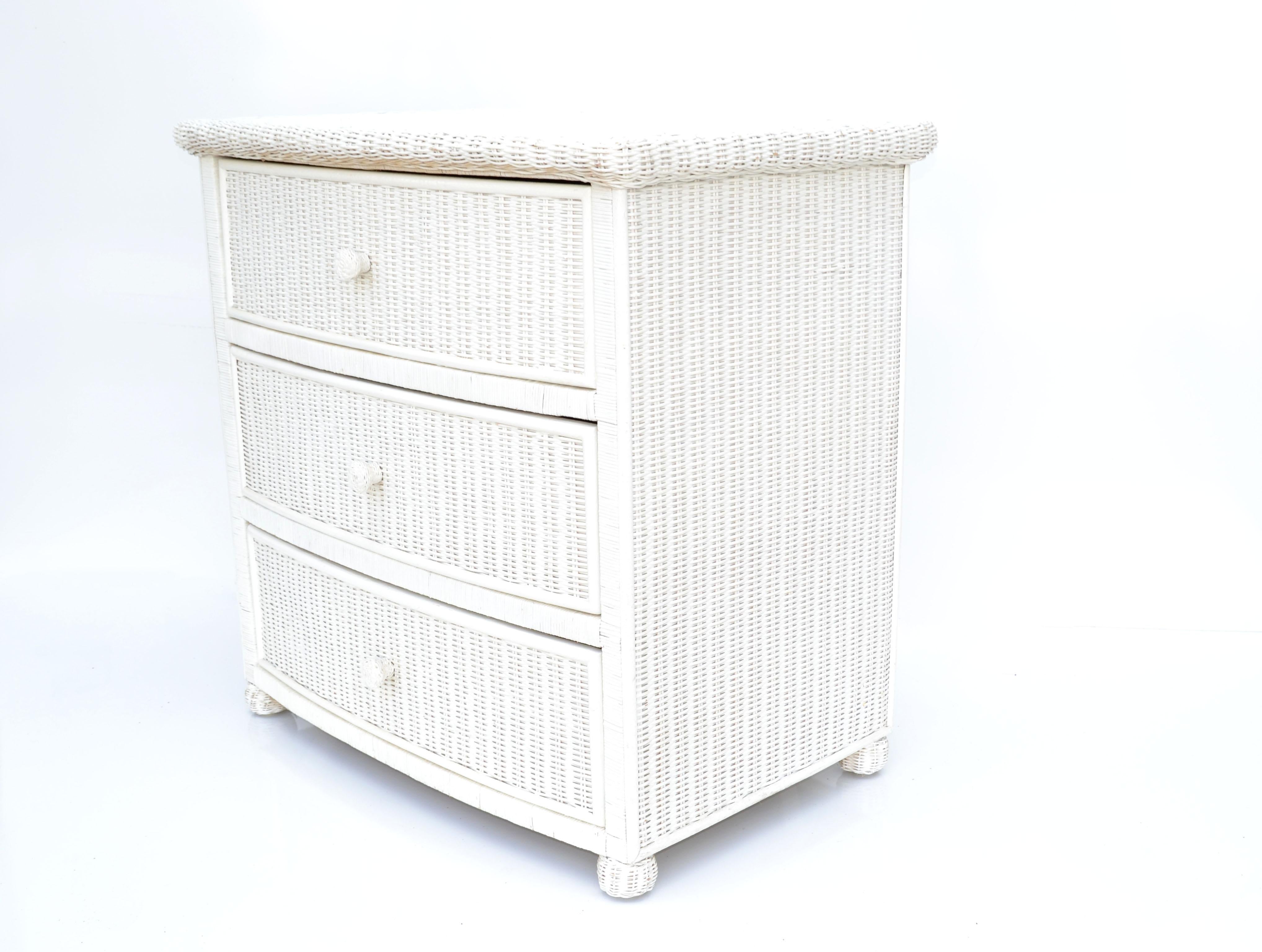 American Mid-Century Modern wicker by Henry Link handcrafted 3 drawers wicker dresser, commode or chest of drawers.
All hand woven cane and a wooden back wall. 
All original 1980s condition with some minor scuffs to the finish.
Great for your