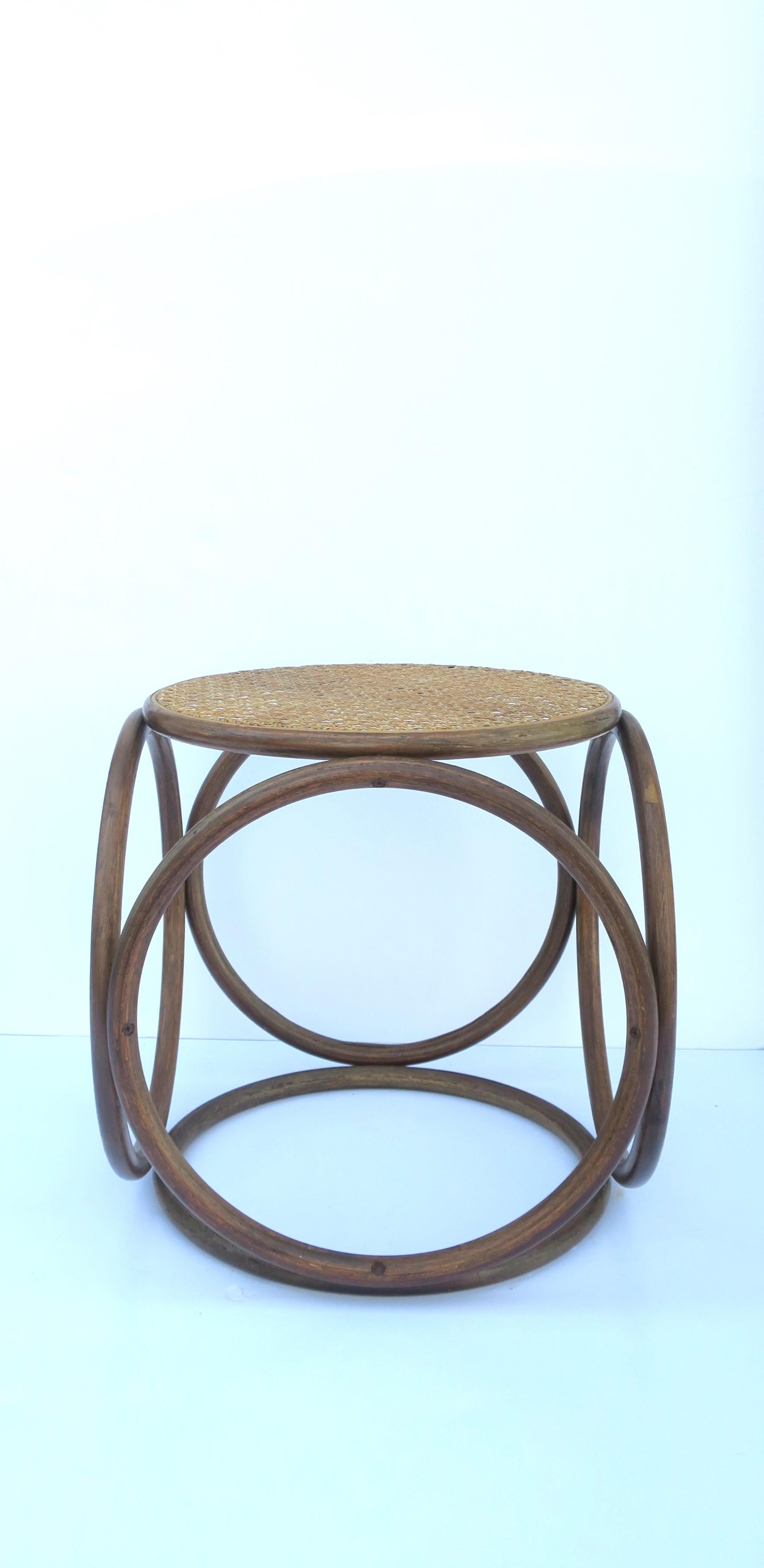 A modern bentwood and wicker cane top stool or side drinks table, in the style of Thonet, circa mid-20th century, Europe, possibly Austria. Piece works as a side drinks table or stool. 

Dimensions: 15.13